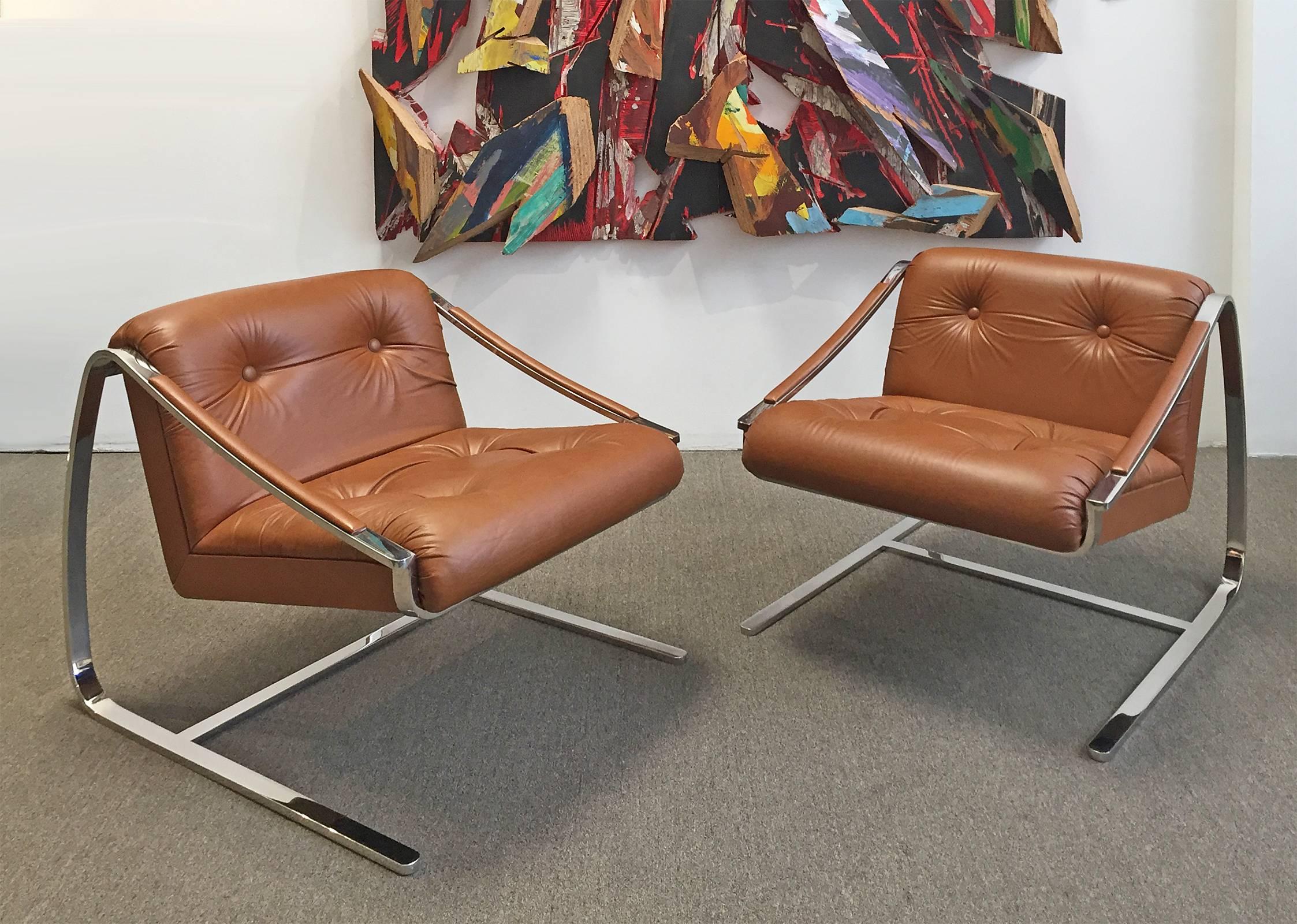 Exceptional pair of heavy polished steel and leather "Plaza" lounge chairs. Made by Brueton Furniture. Designed by Charles Gibilterra. Ultra modern style. Designed for comfort. Fresh and ready for use. Price is for the pair.