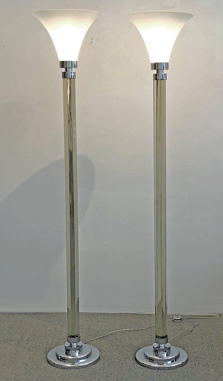 Pair of glass and polished chrome torchiere lamps. Frosted glass shades with a stem made of five solid glass rods. Polished chrome-plated steel fittings and base with foot switch. Top quality design and construction.