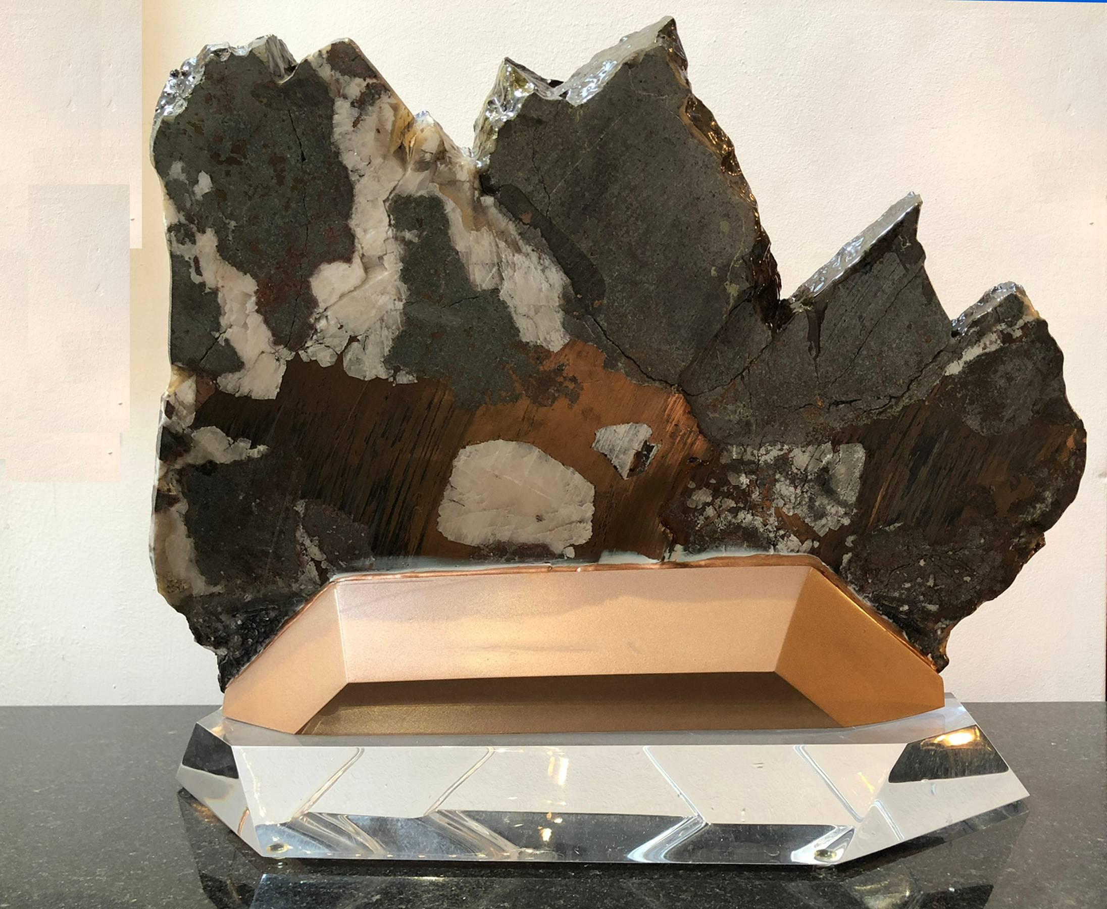 Mineral specimen that has been polished and custom mounted on Lucite.