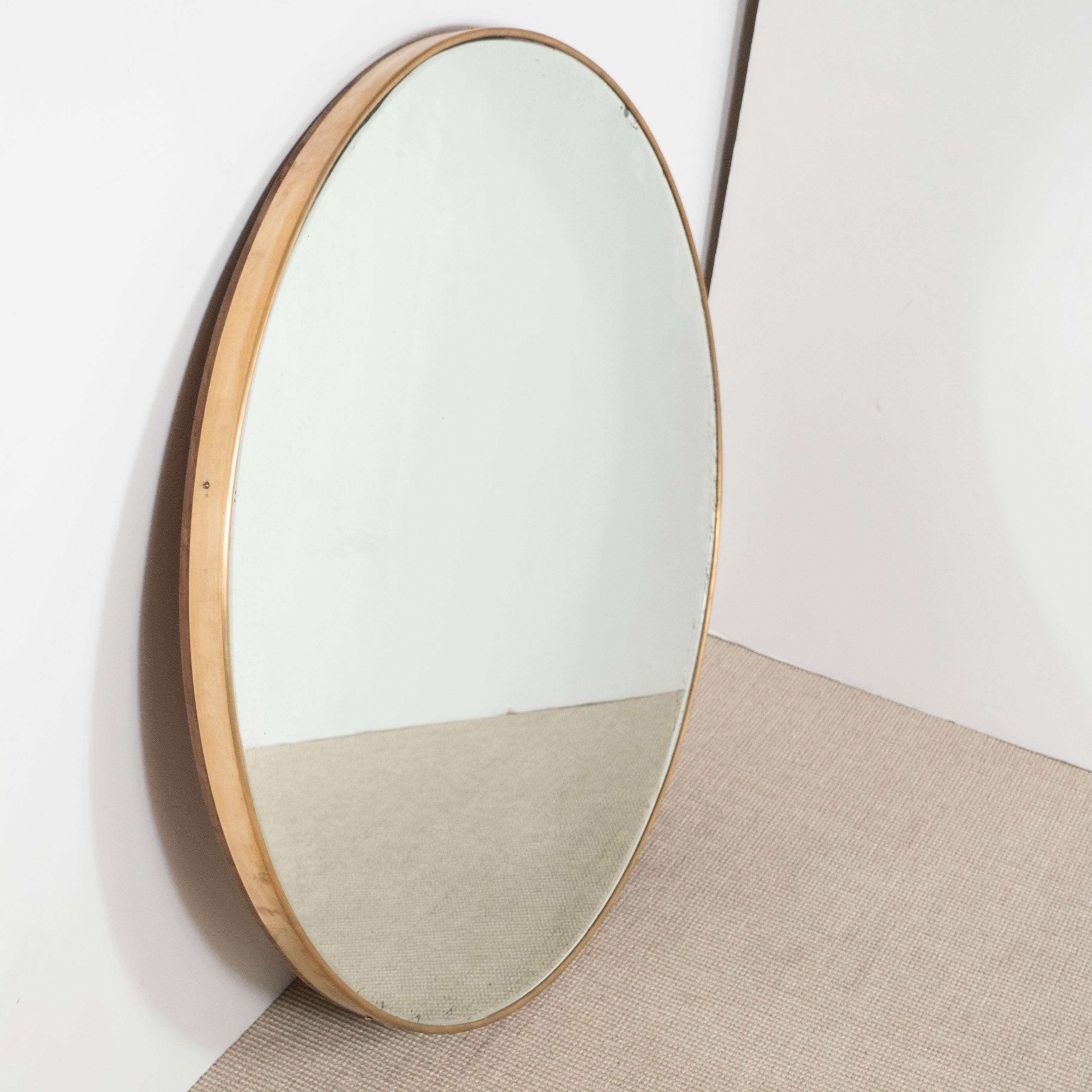 Italian modernist brass framed round mirror, circa 1950s.