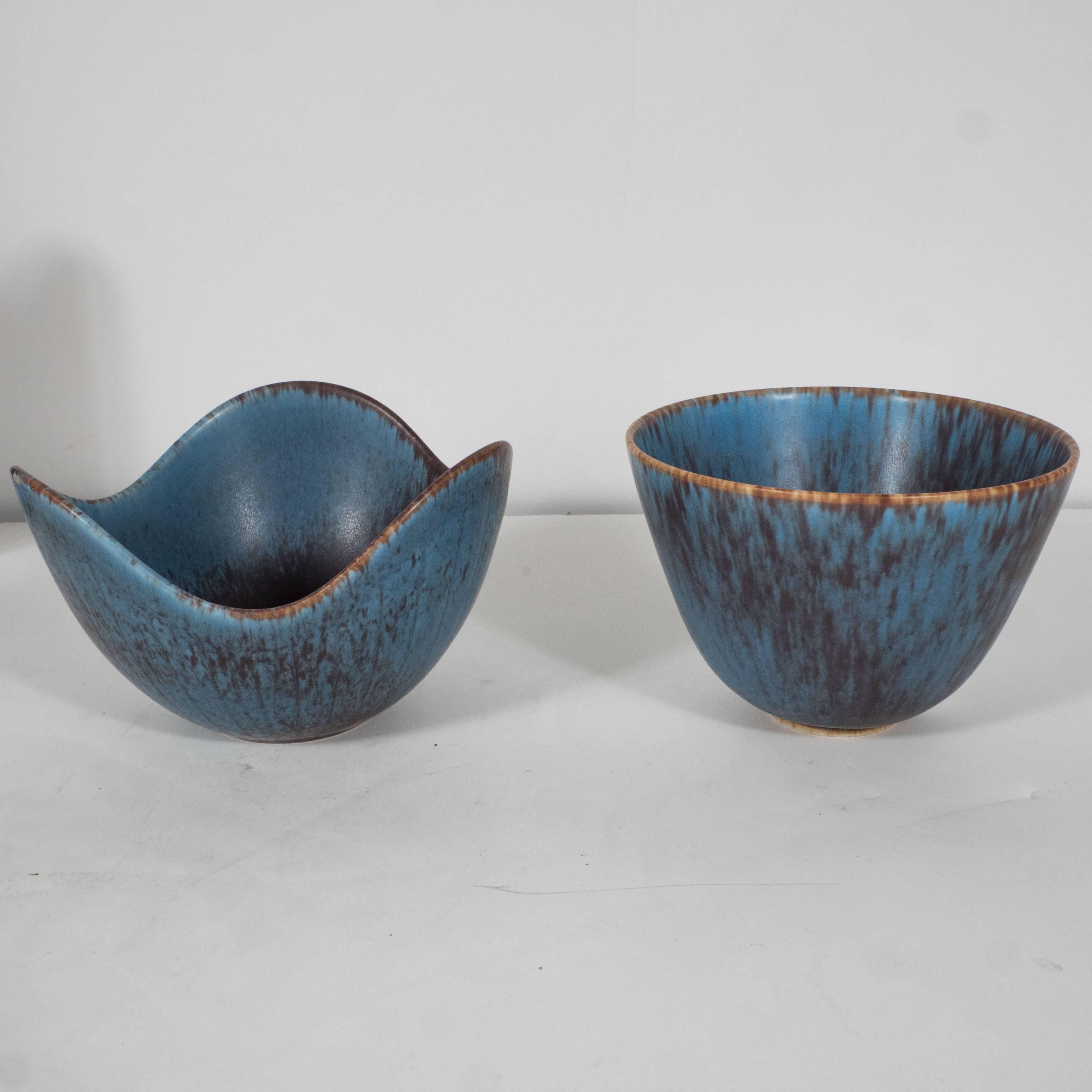 Set of four blue Swedish ceramics. A- H: 3.5 diameter: 5.75 in. C- H: 8 diameter: 1.5 in. 
B- H: 3.5 diameter: 5 in. D- H: 7 diameter: 4.25 in.
  