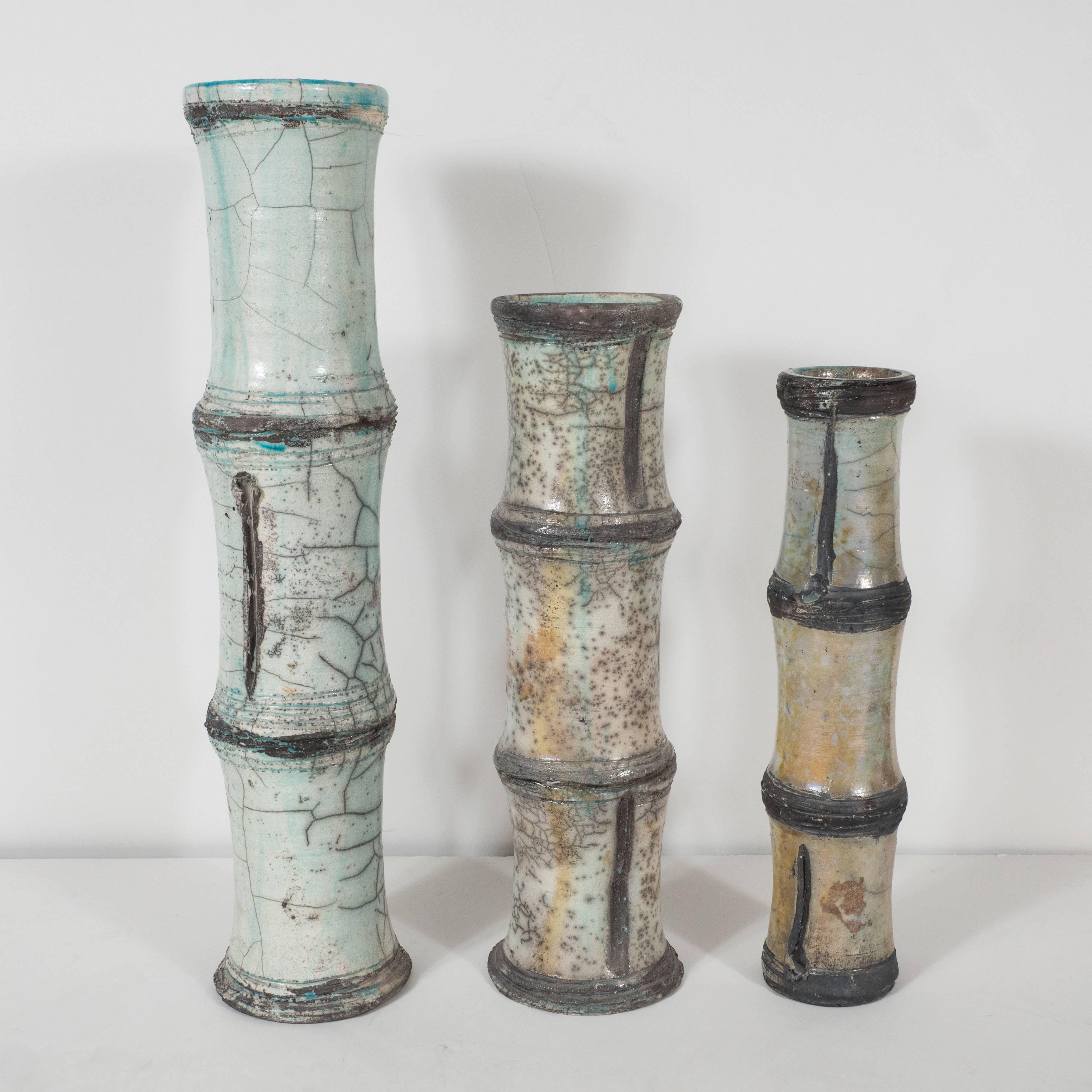 Three ceramic vases, bamboo pattern, vallauris raku. Big: Height 18.5, diameter 4.25 in.
Medium: Height 14.5, diameter 3.75 in.
Small: Height 13, diameter 2.75 in.
 