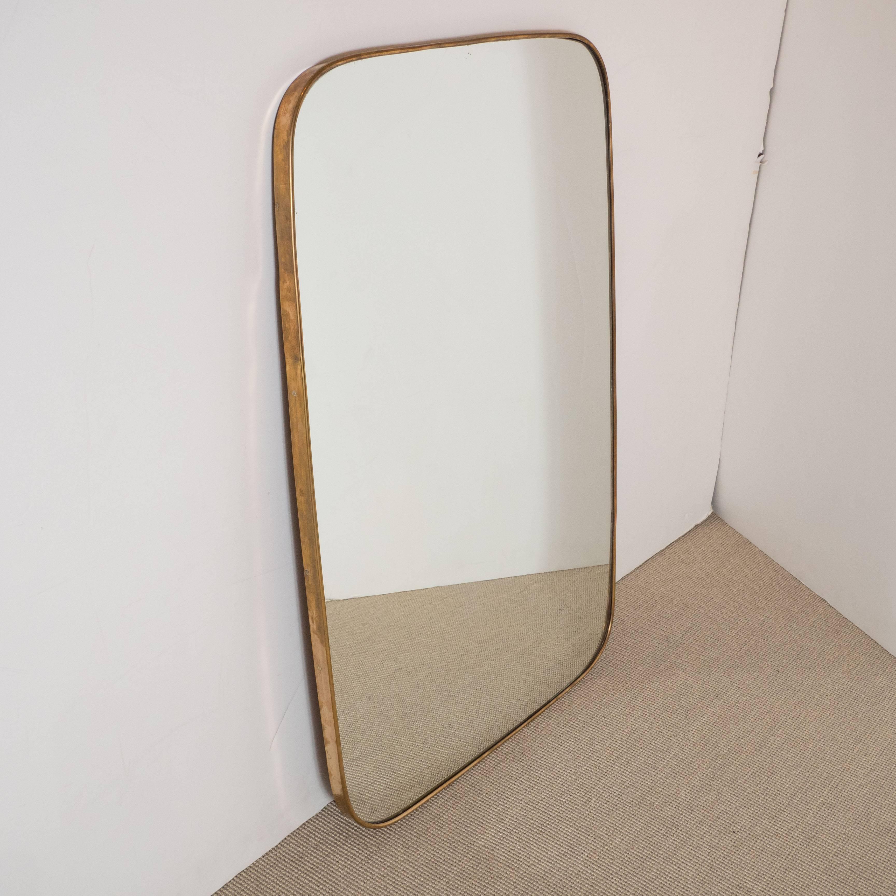 Italian modernist mirror in a cushion shape.