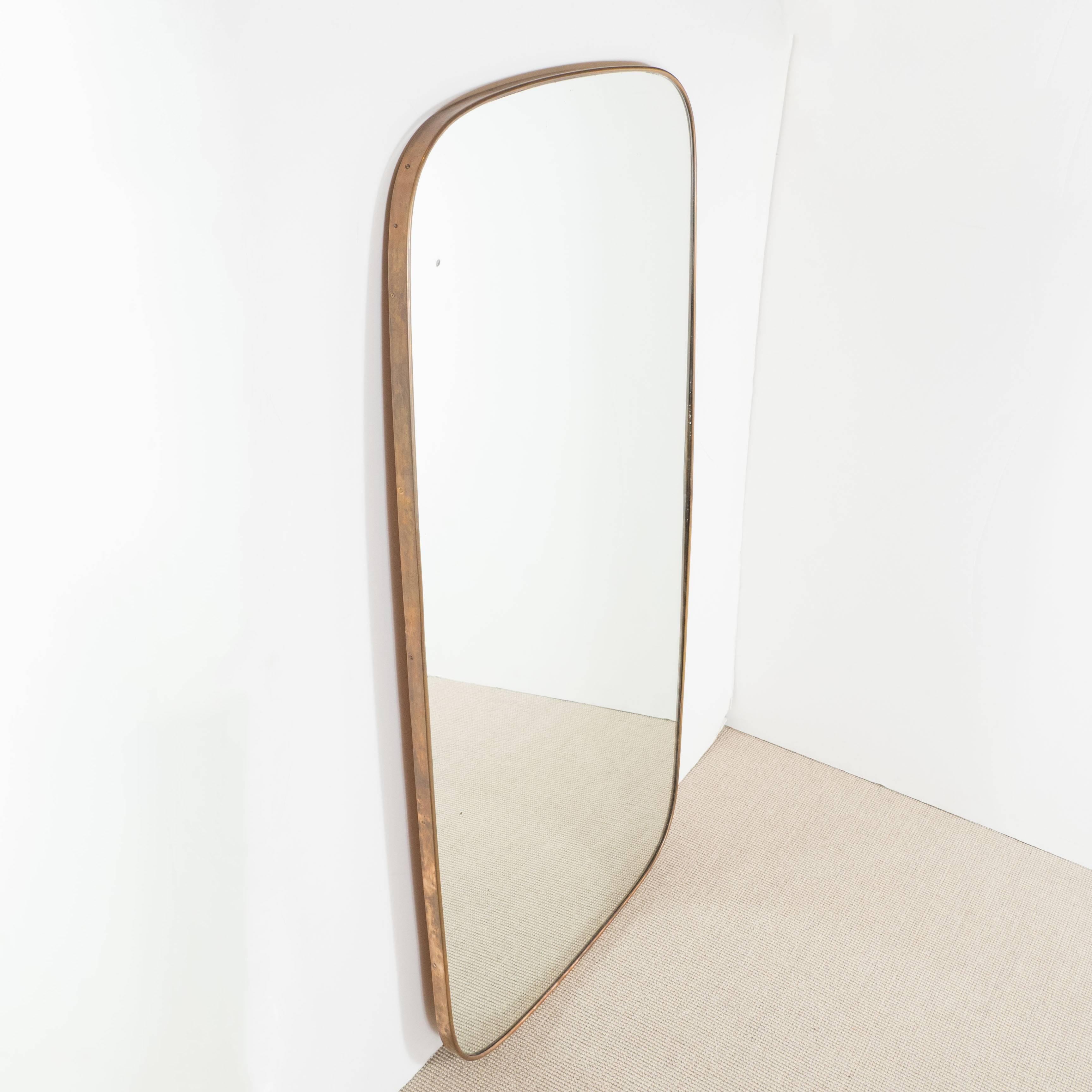 Italian modernist mirror in a cushion shape.