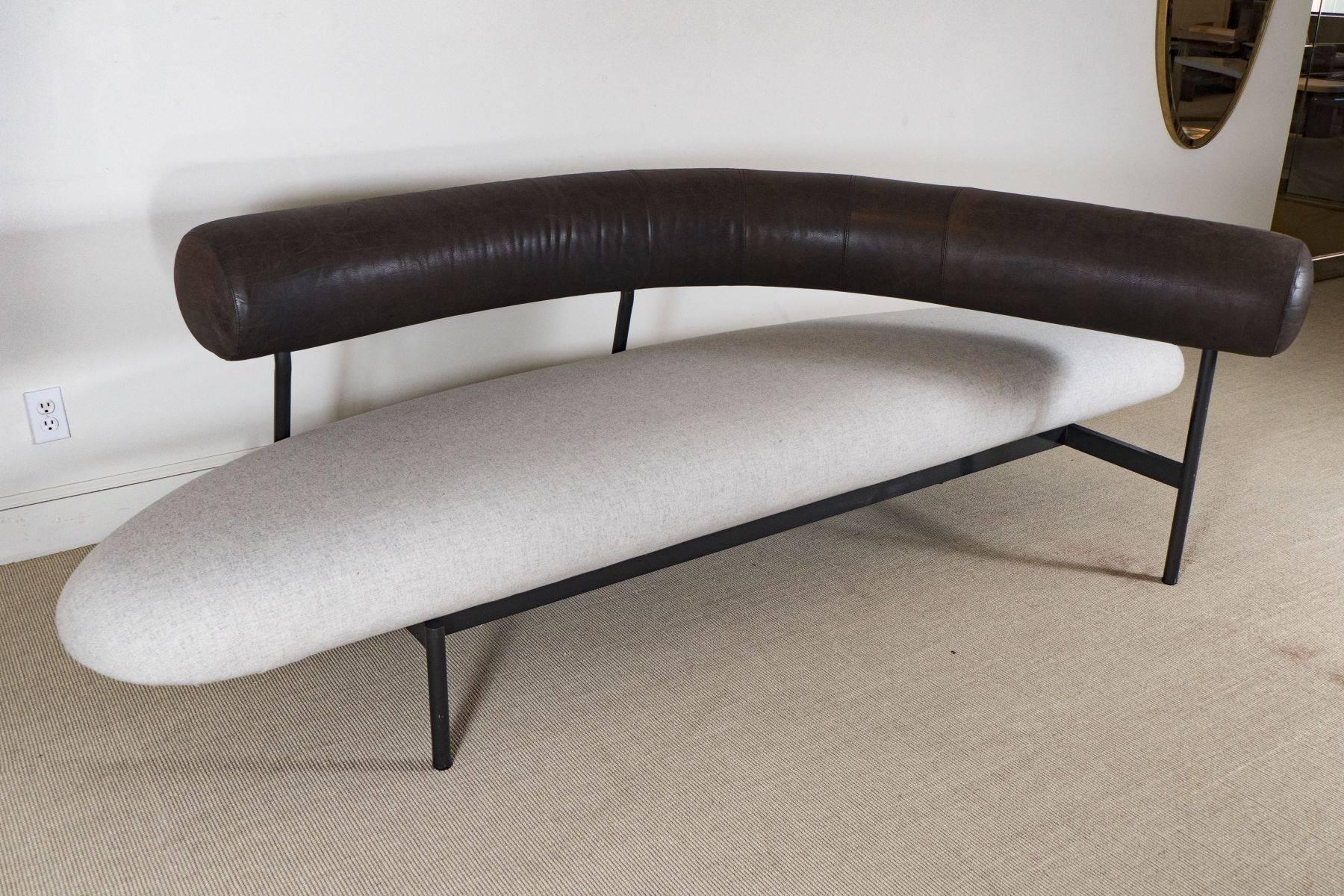 Sculptural sofa with brown leather backrest and beige linen seat on a black iron frame by Xavier Mariscal, Spain, circa 1980.