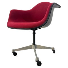 VIntage Red Upholstered Swivel Chair On Wheels By Charles And Ray Eames