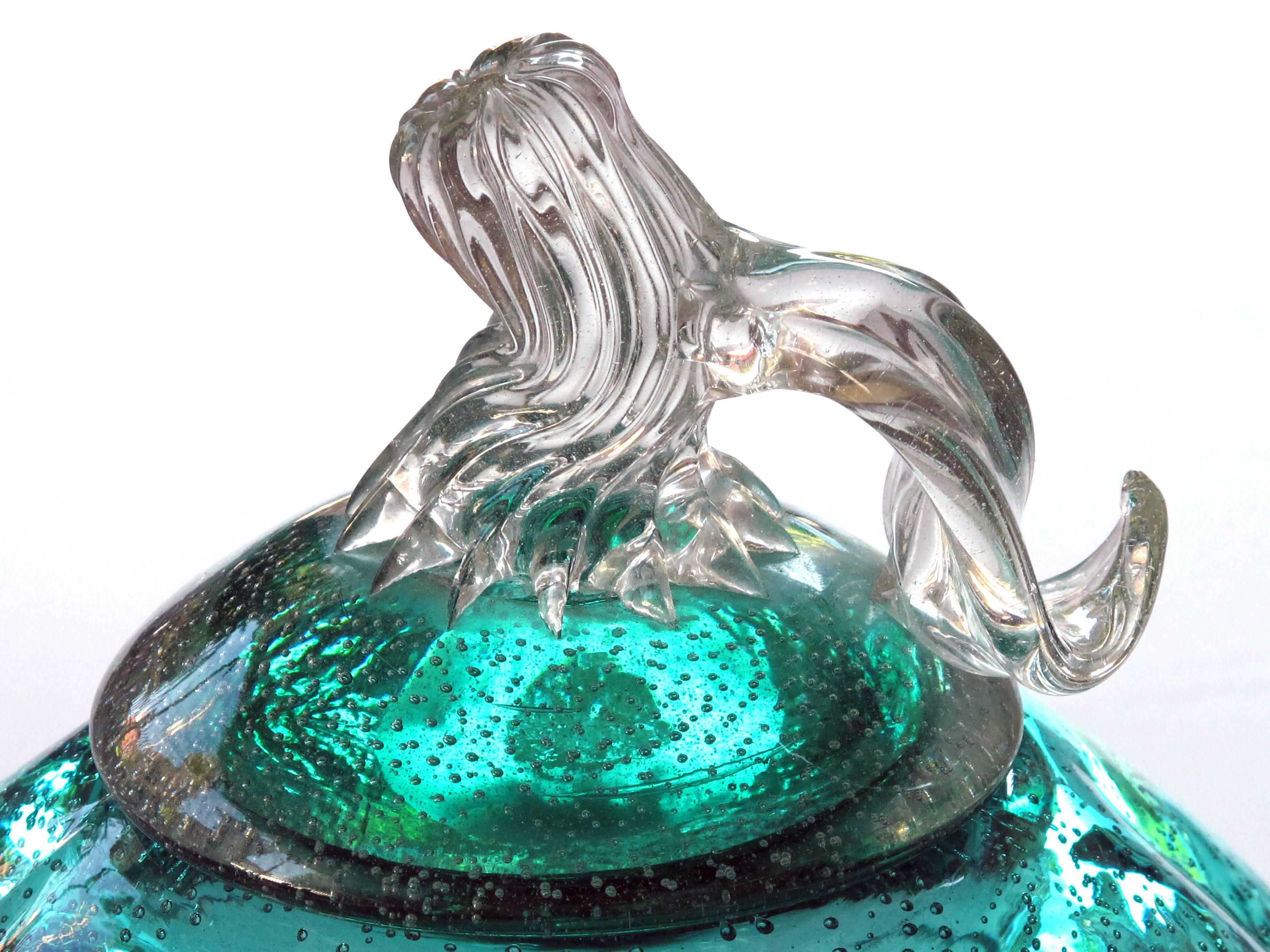A whimsical Murano 1950's teal art glass gourd with lids; the removable top with clear stem and leaf resting on a lobed gourd-form body