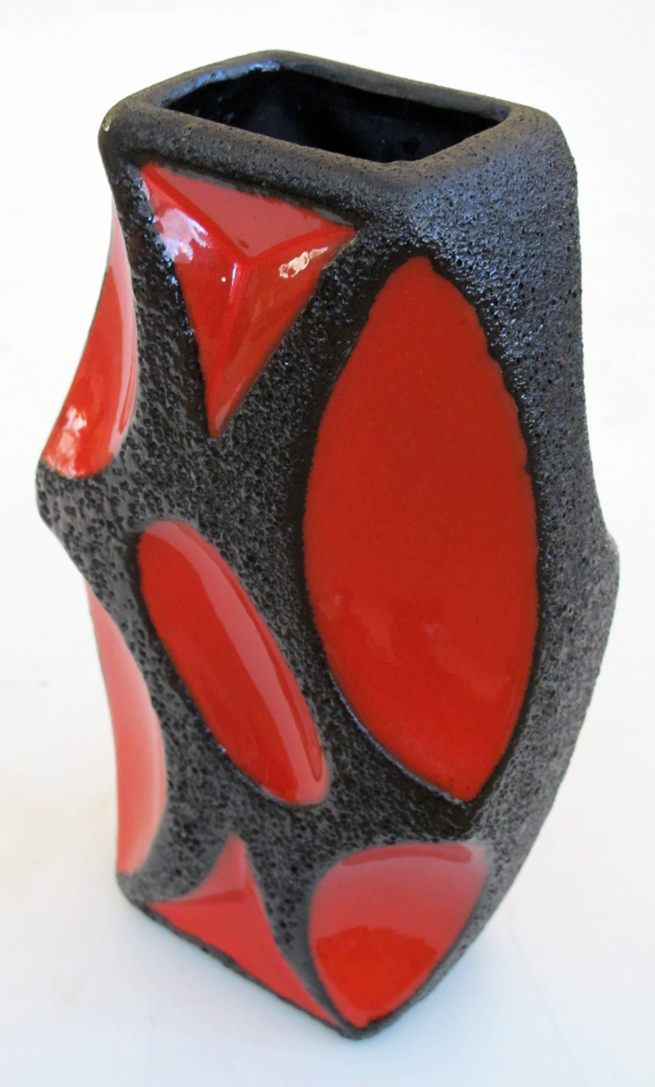 A mod pair of West German Roth Keramik art potter 'fat lava' vases with red glaze; each of elliptical form with lava glaze and red glazed reserves; marked 1970.