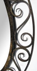 A French Art Deco Openwork Iron Oval Mirror in the Style of Edgar Brandt