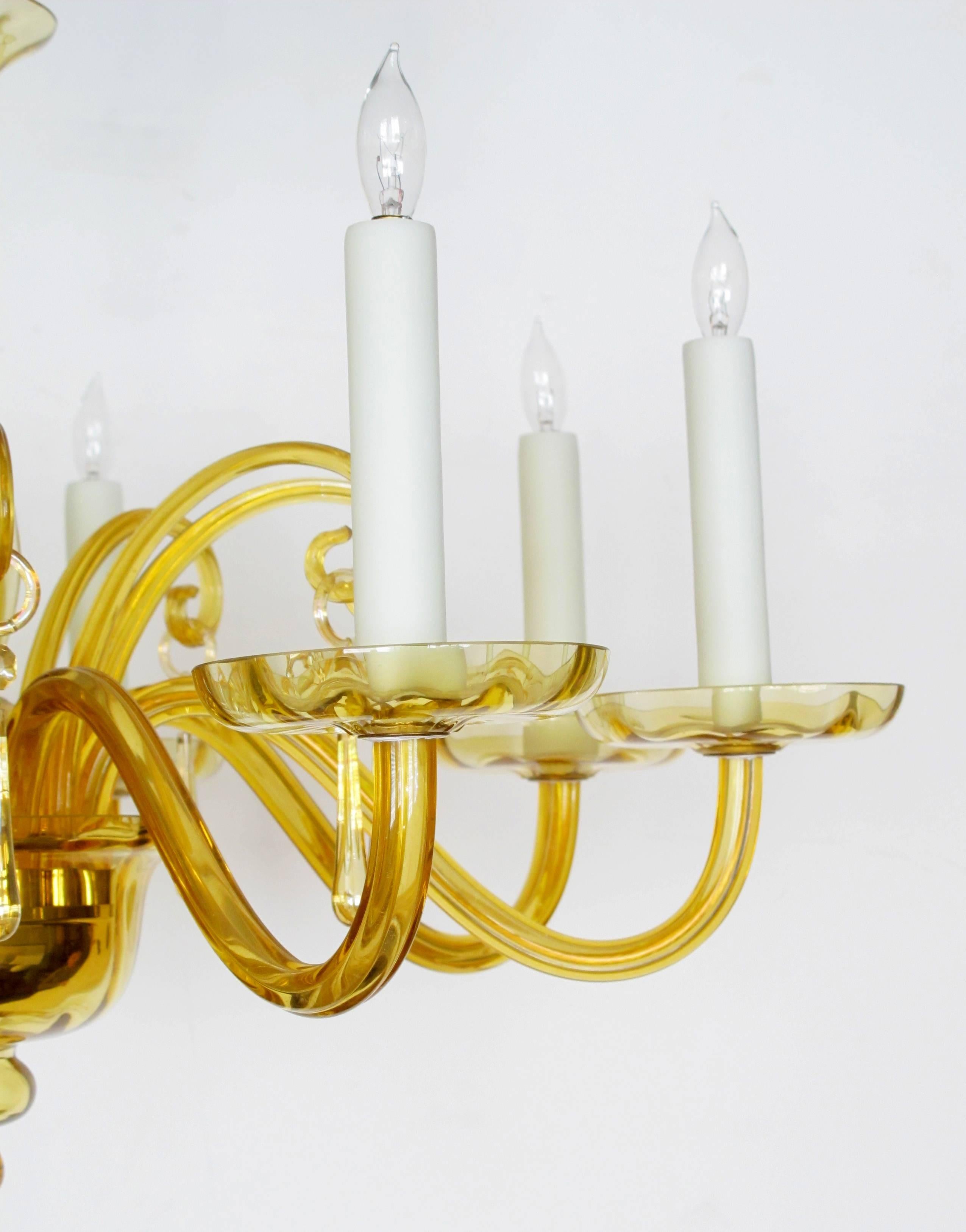 A richly-colored Murano, 1960s butterscotch glass six-light chandelier; the baluster support above a cup-shaped bowl with pendant knob; all emanating six scrolled arms interspersed with down-swept tendrils.