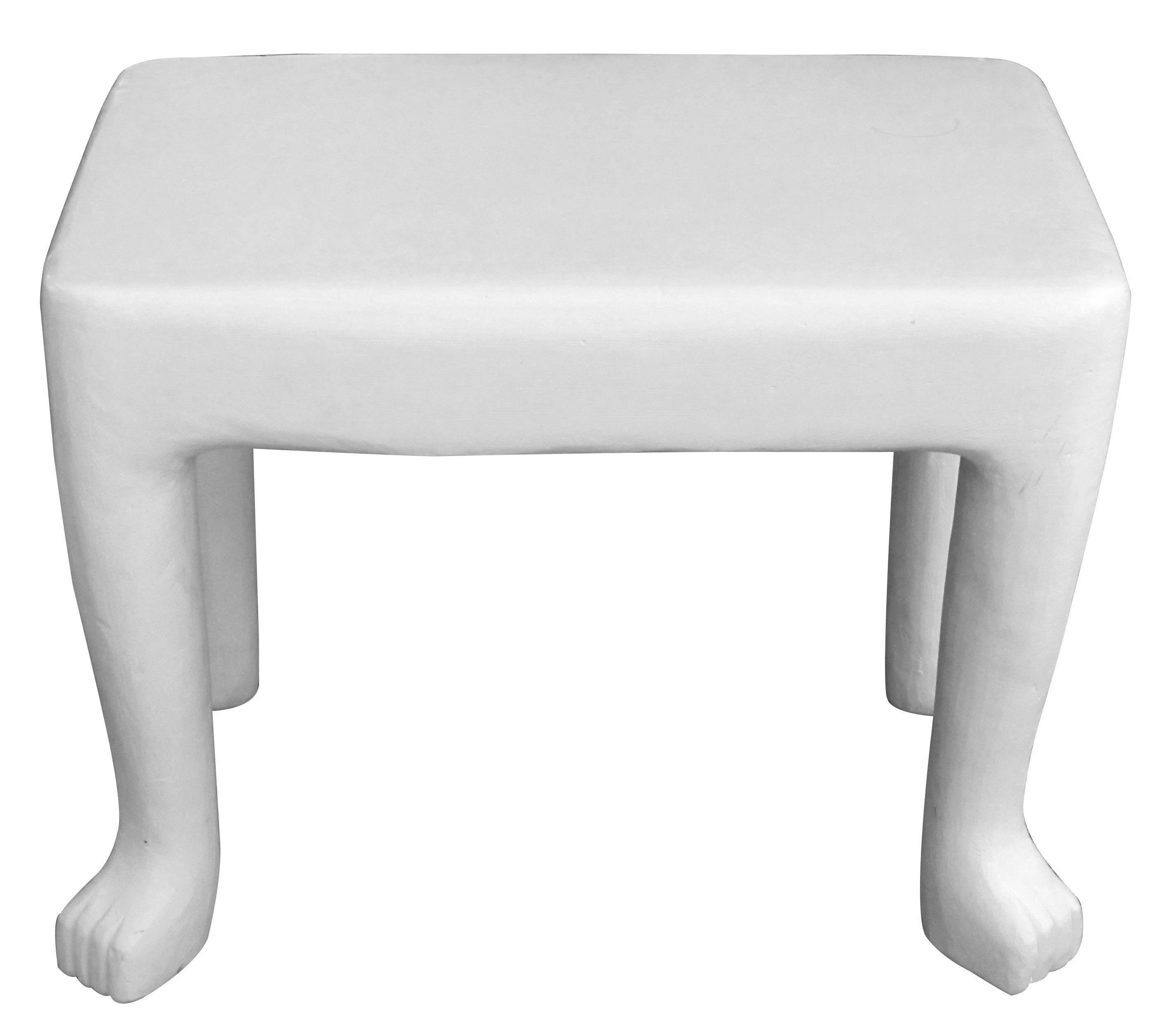 An original and iconic American, 1970s John Dickinson African-Series plaster occasional table (model 103); ex-collextion Gary Hutton, San Francisco; of painted white plaster with thick rectangular top raised on chunky supports ending in paw feet;