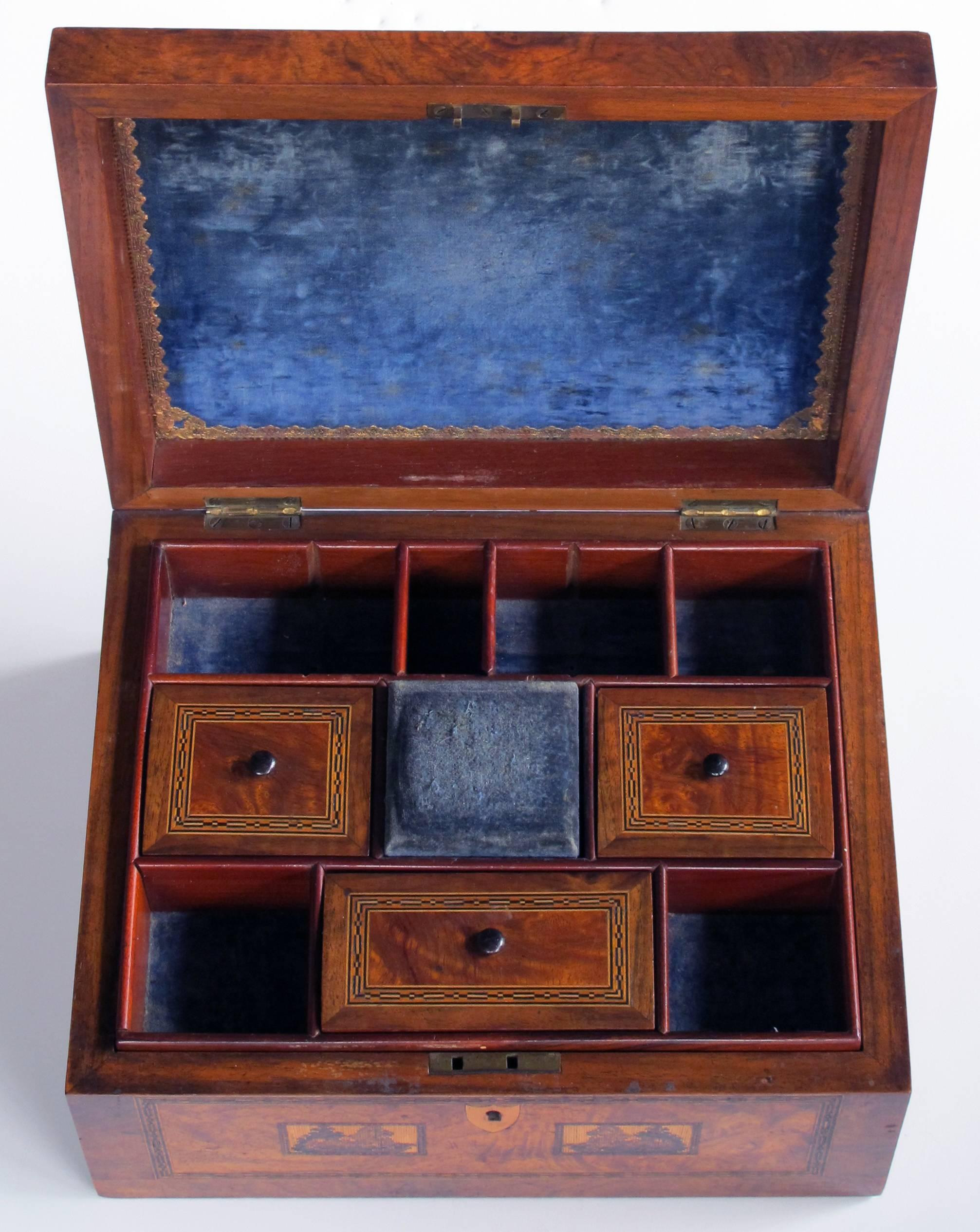 A well-crafted English Tonbridge Ware inlaid burl wood dressing box depicting 'Bodiam Castle'; signed and dated on underside of cushion compartment 'Made by Thomas Barrett 1811-1883'; the richly-patinated box opening to reveal a compartmentalized