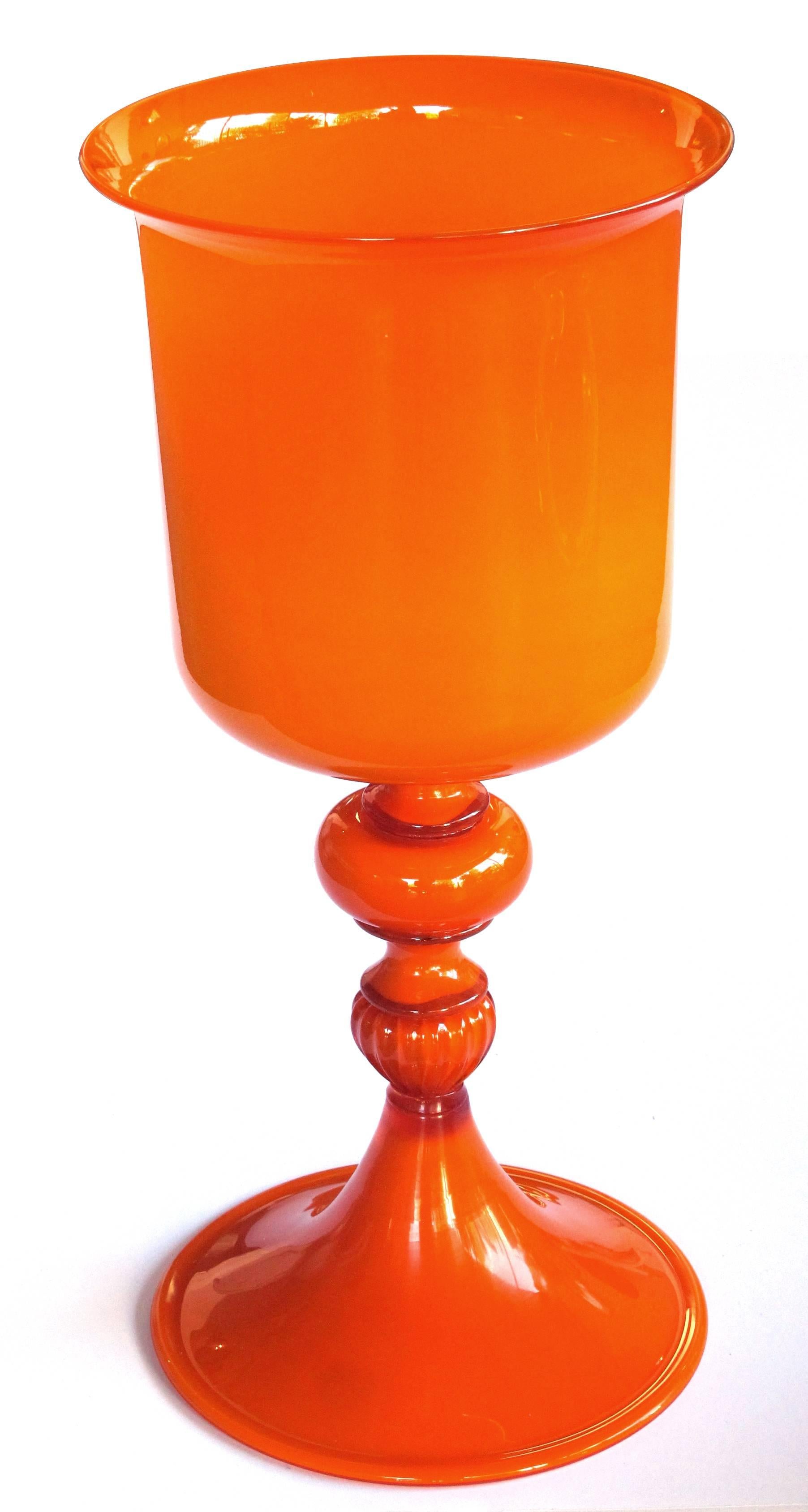 A striking and large-scaled set of Murano 1960s orange cased-glass covered bowl and compote; each of dazzling orange cased-glass with covered bowl and compote; with foil label 'made in Italy, Murano'.