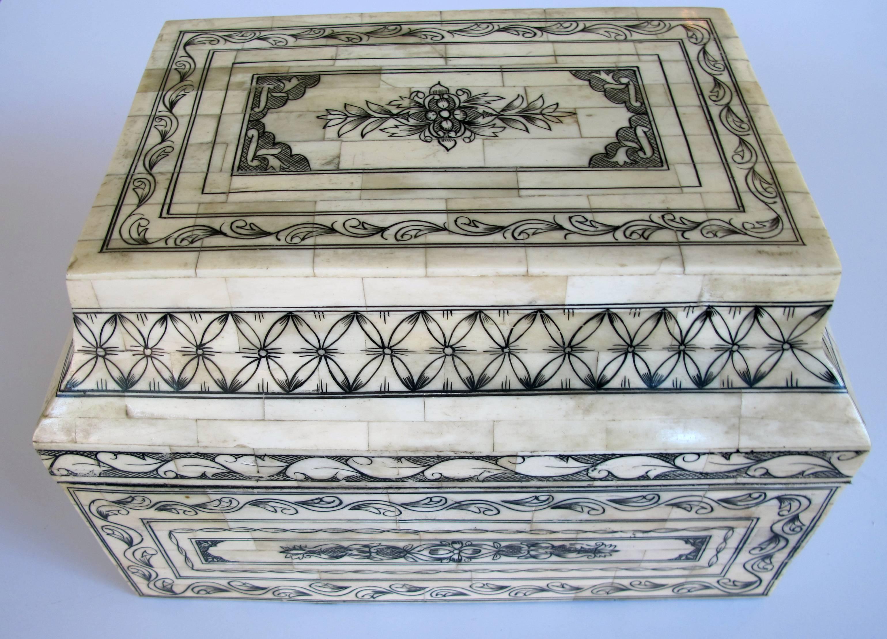 An intricately decorated and large Moroccan sarcophagus-form box with hinged lid.