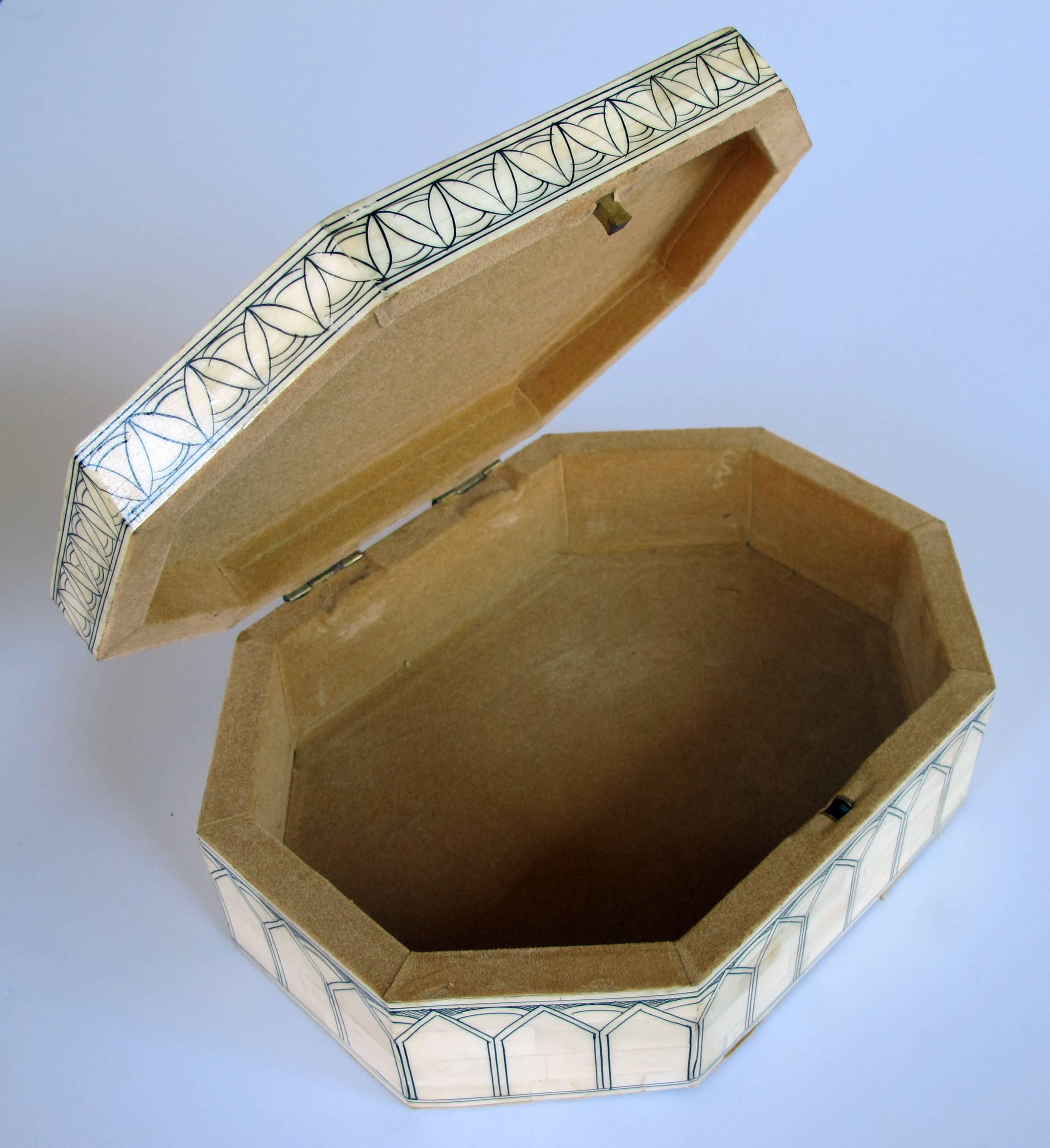 An intricately decorated Moroccan octagonal bone box with hinged lid.