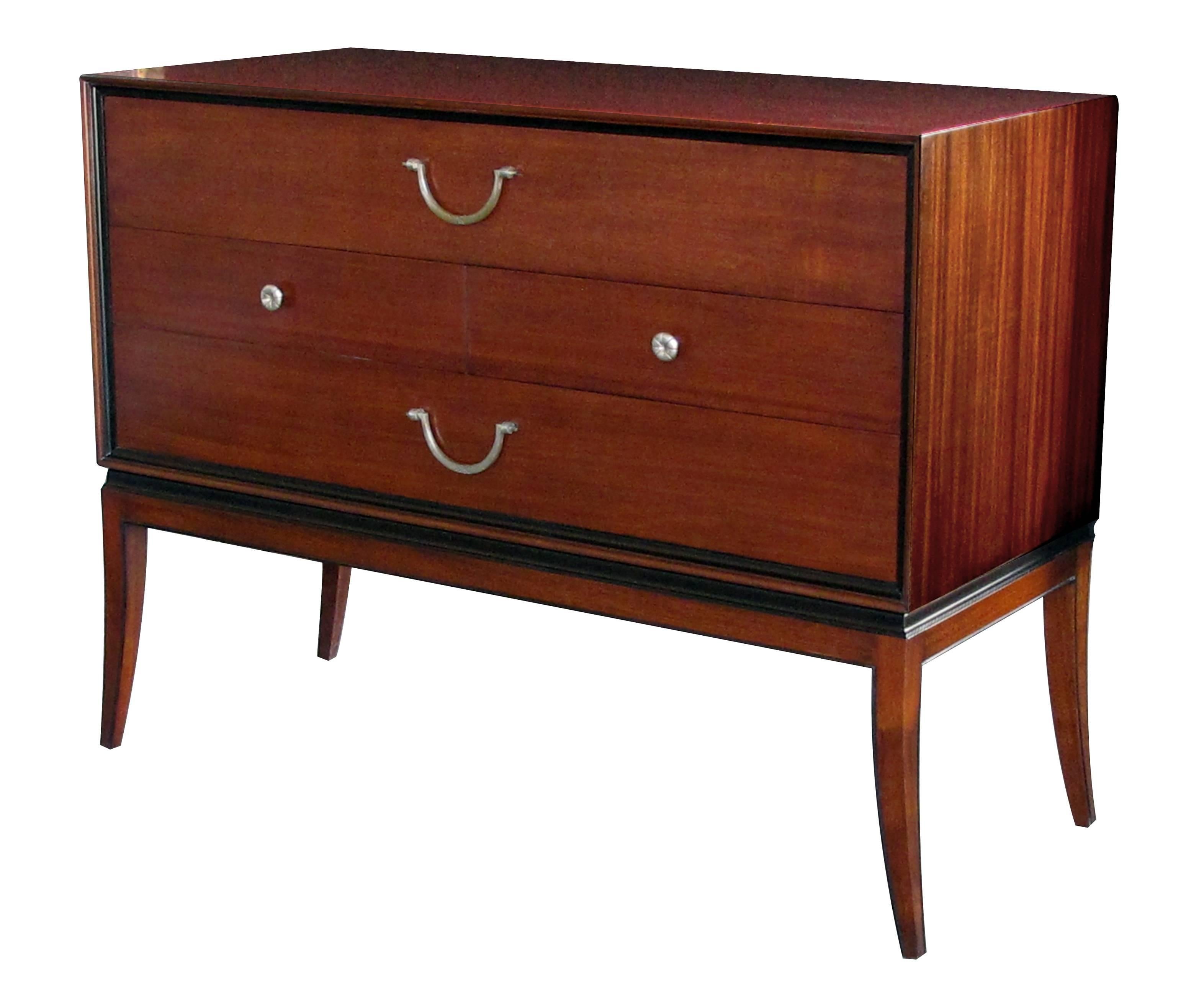 An extremely good quality Tommi Parzinger designed for Charak Modern Mid-Century mahogany four-drawer cabinet/chest with ebonized highlights; Tommi Parzinger at his best with its clean lines and tailored look, all in a rich ribbon mahogany and
