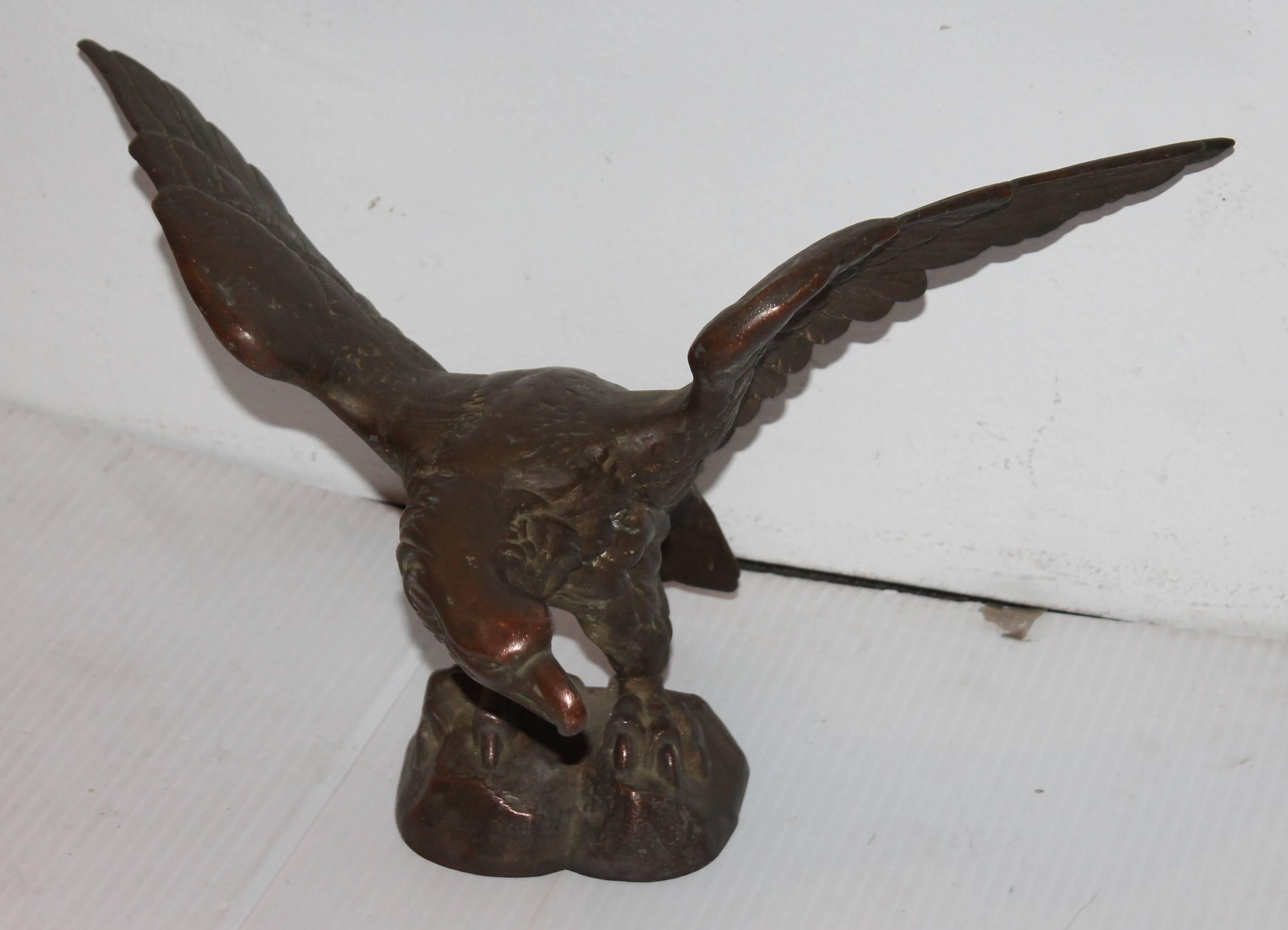 This eagle statue was in a lobby of an old Post Office from back east. It is a molded bronze 19th century heavy eagle. The condition is very good with a nice mellow patina.