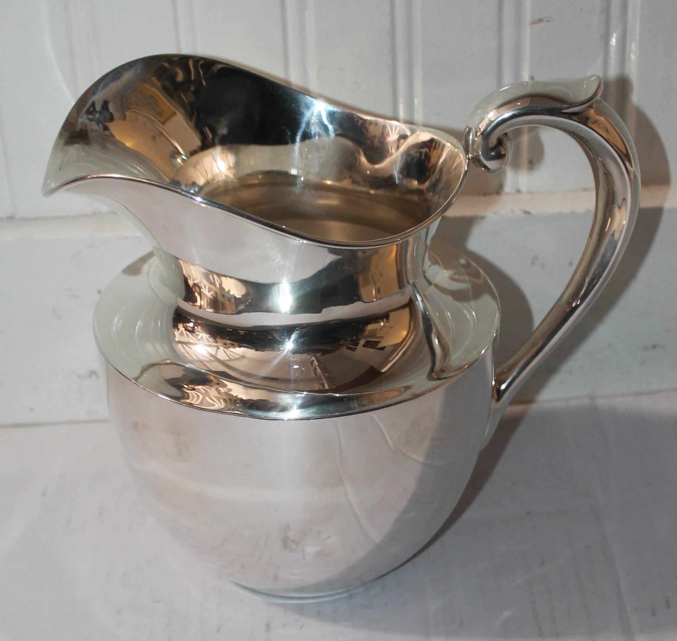 American Pair of Sterling Silver Large Water Pitchers