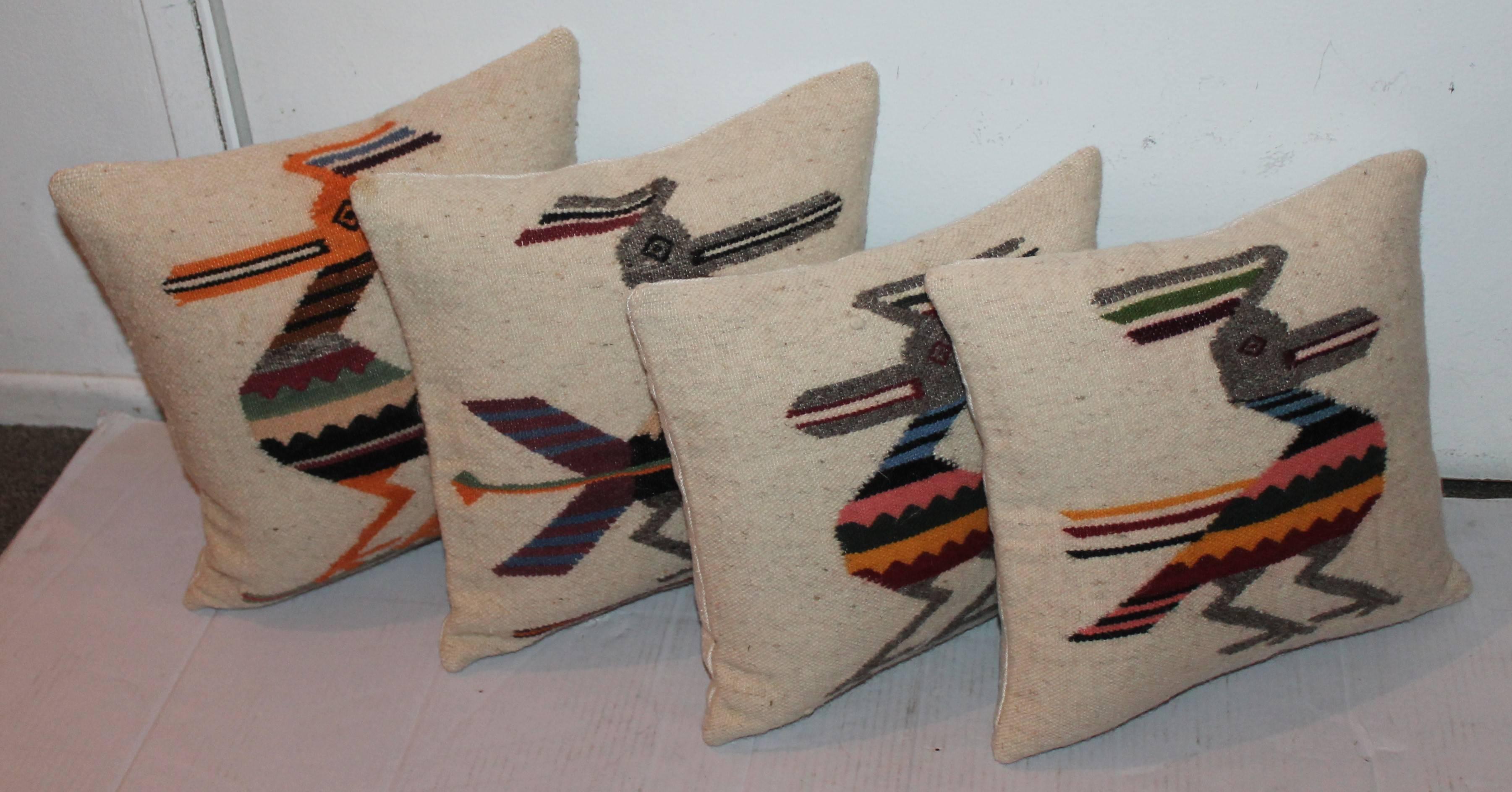 These handwoven Mexican Indian weaving pillows are in Fine condition and have woven cotton linen backing. Sold as a group of four and all are slightly different.