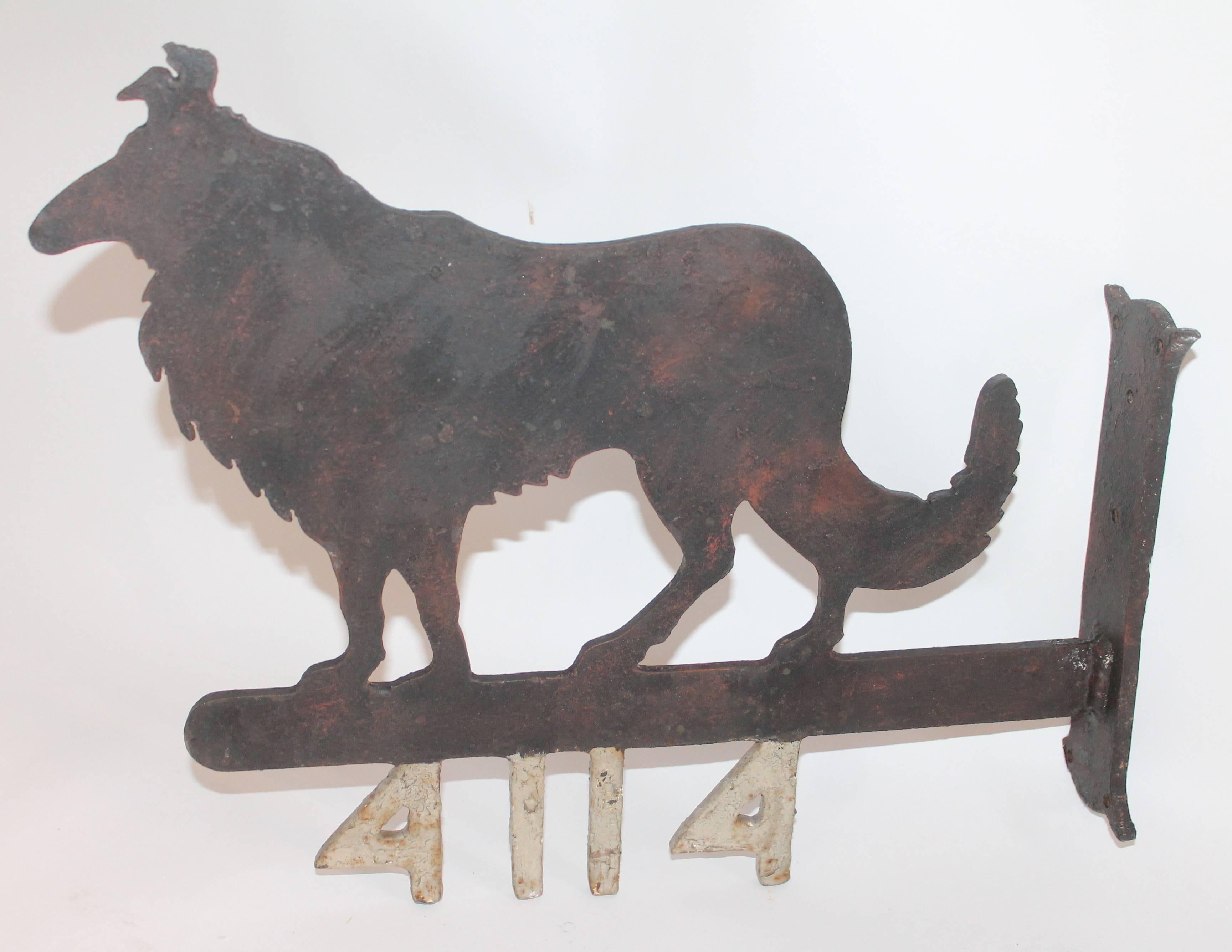 This numbered sign was from a farmhouse and they probably raised or bread dogs. The number 4114 was to designate the property address. This is a double sided trade sign of sorts. The painted surface is original as found. The condition is very good.