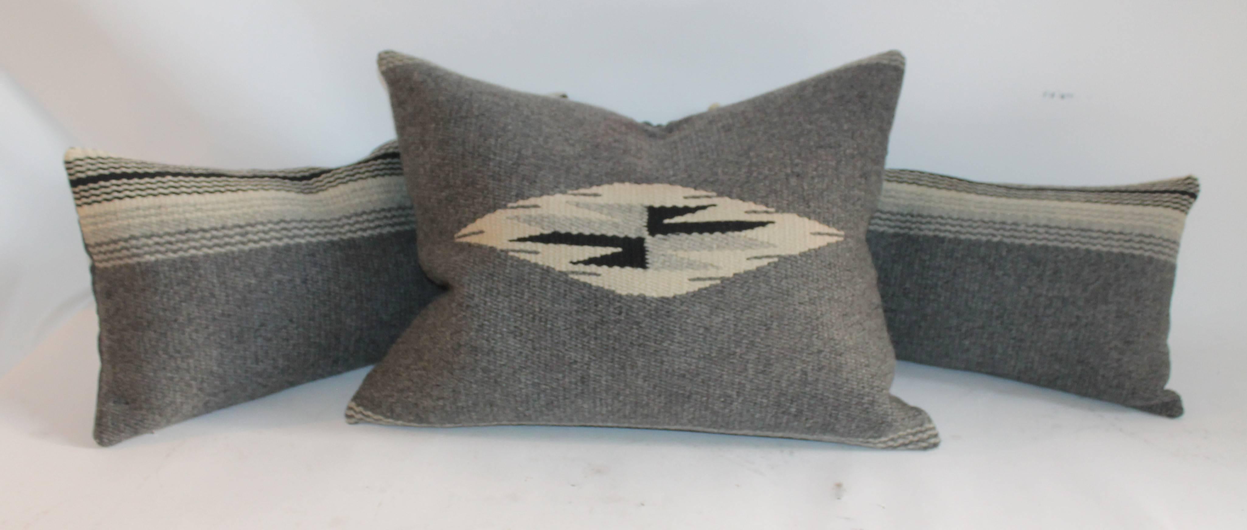 Great pattern Chimayo pillows in excellent condition. Two bolster pillows with stripes and one larger pillow. Sold as a group of three.

Measures: Bolster pillow measures: 22" x 11"
square pillow measures: 23" x 18".