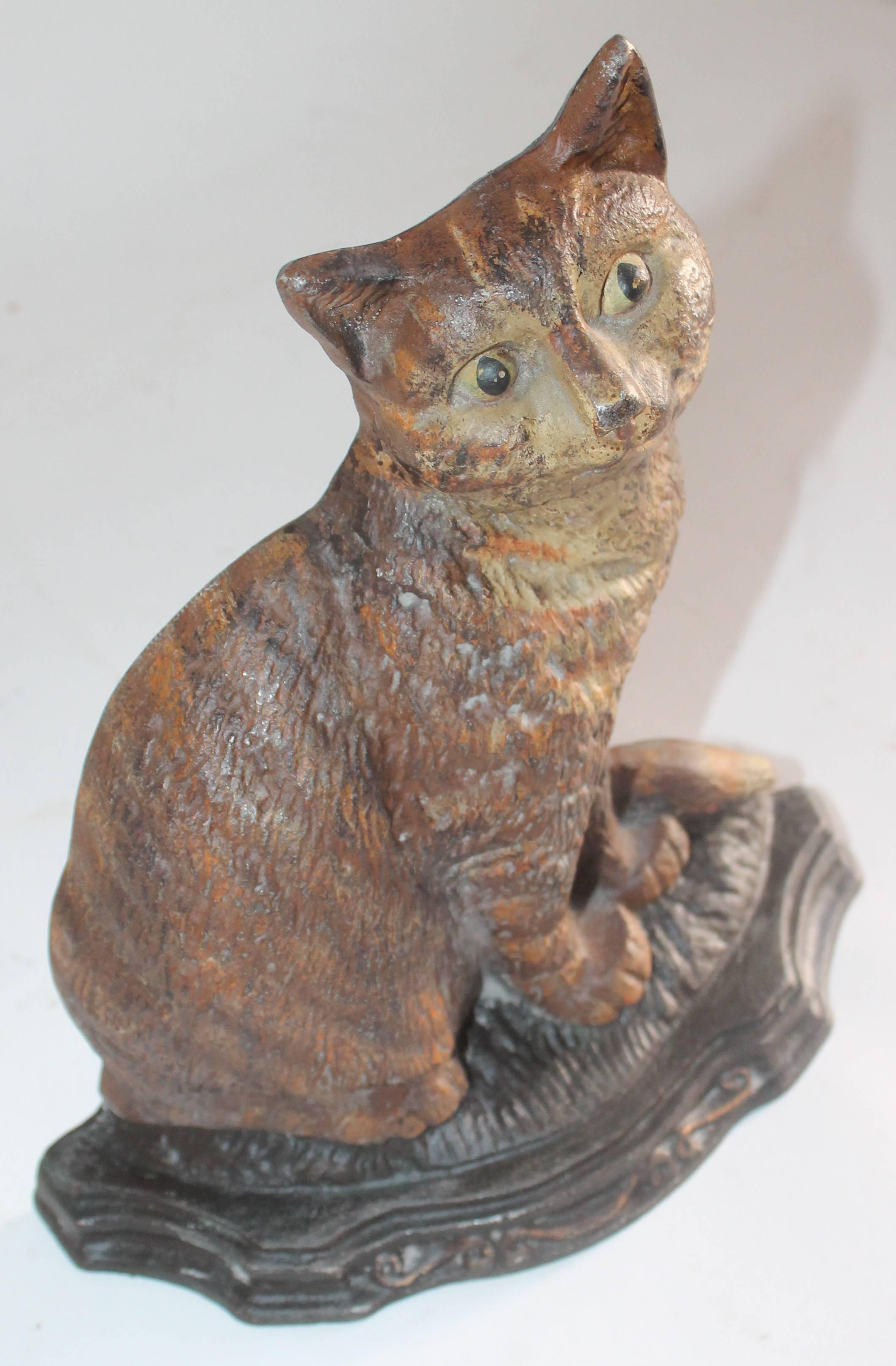This folky Taby cat is painted cast iron door stop. The base has minor wear but is in very good condition.