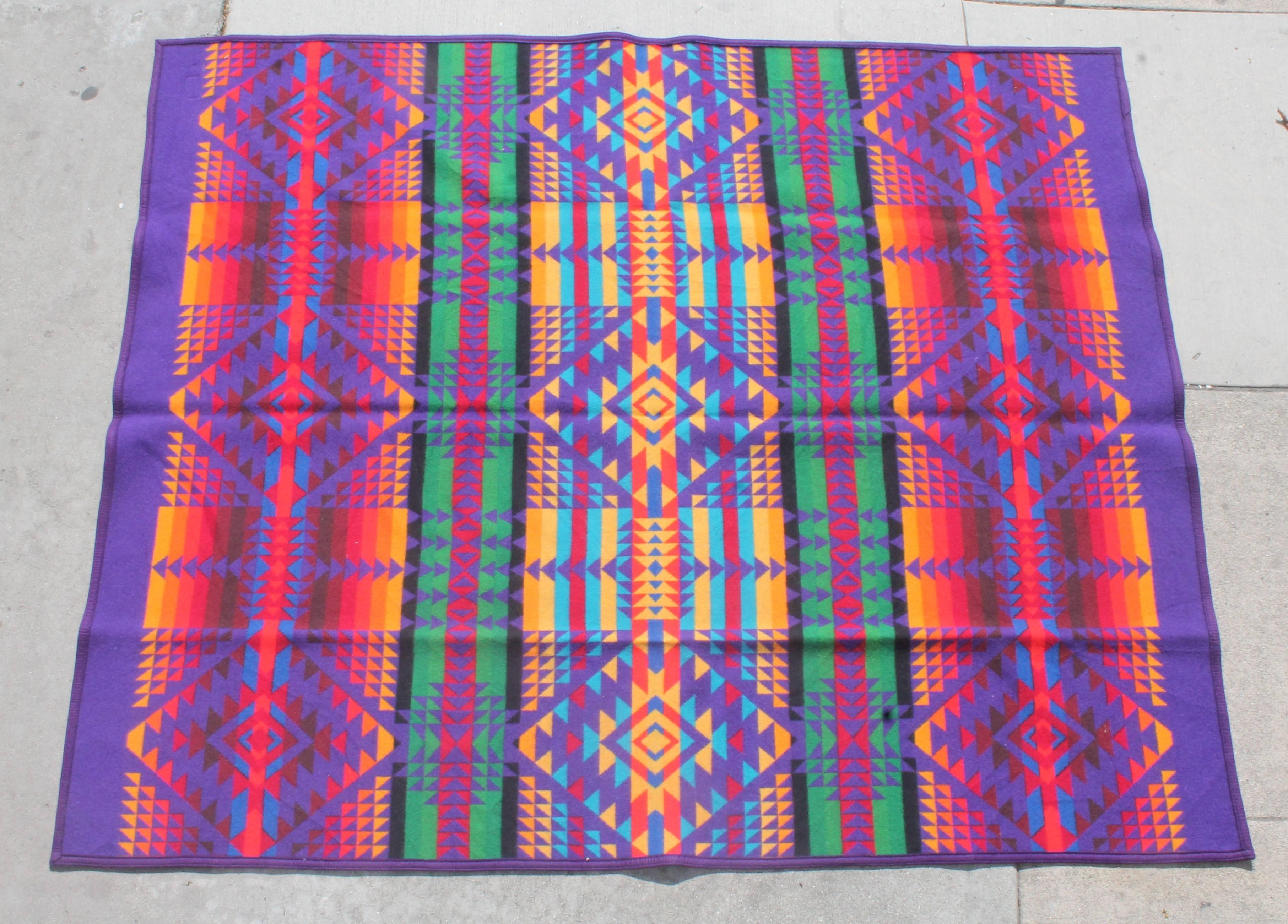 This fine multicolored wool camp blanket is in great as found condition. The original label is on the lower right hand corner of the blanket. These colors are very hard to find in these camp blankets.