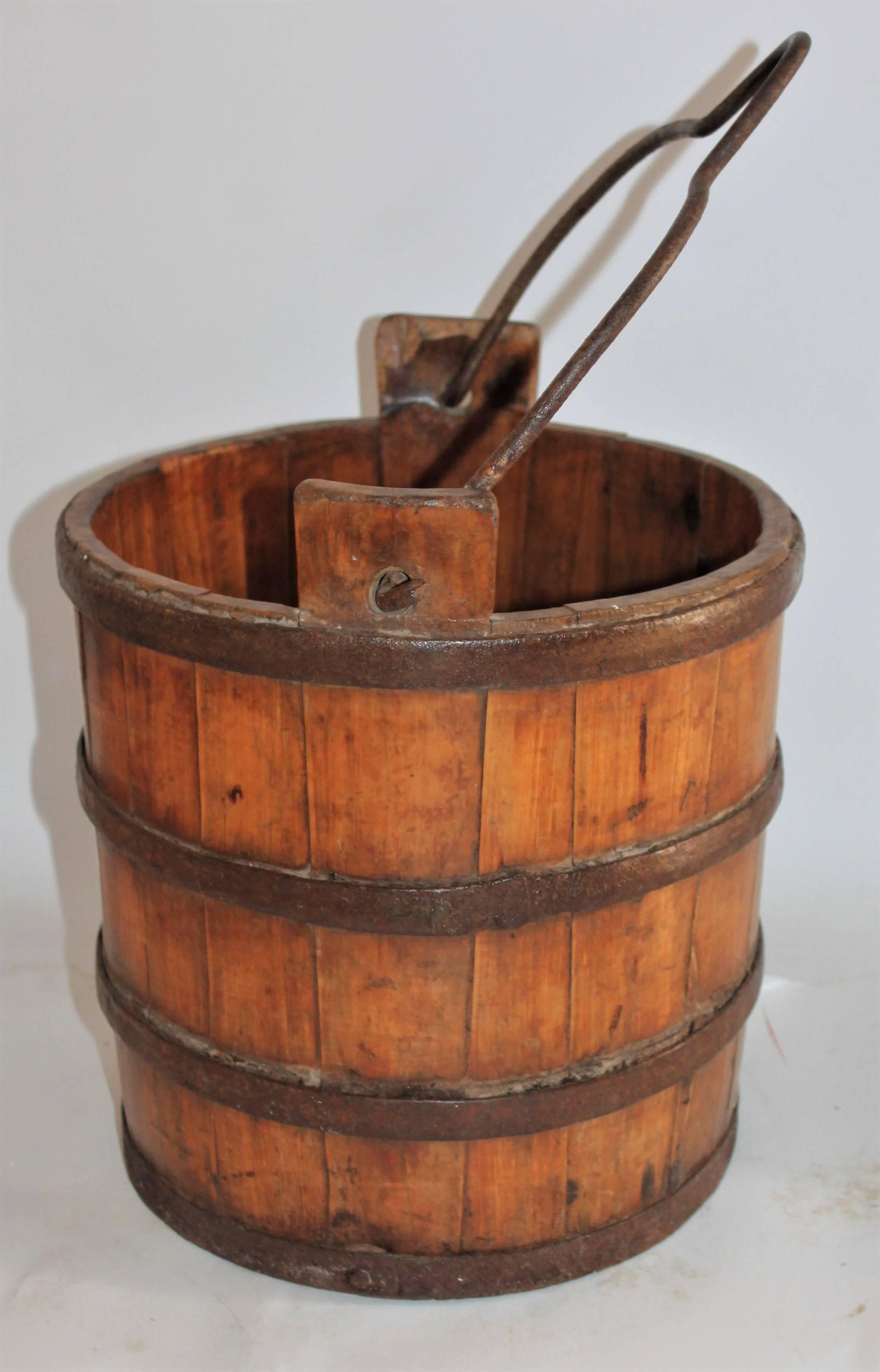 This early handmade water bucket was found in Pennsylvania and has the original hand forged iron bands and handle. The condition is very good. Great for a flower pot or filled with apples.