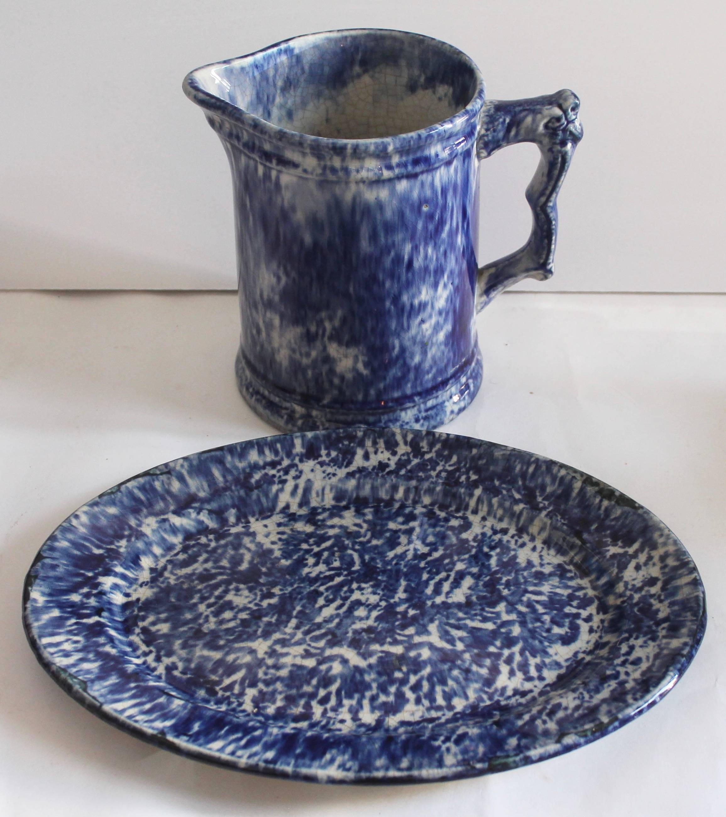 This early 19th century sponge ware oval platter and sponge ware serving pitcher are in great condition with crazing throughout. The back of the platter and interior of the pitcher shows crazing from age and use.