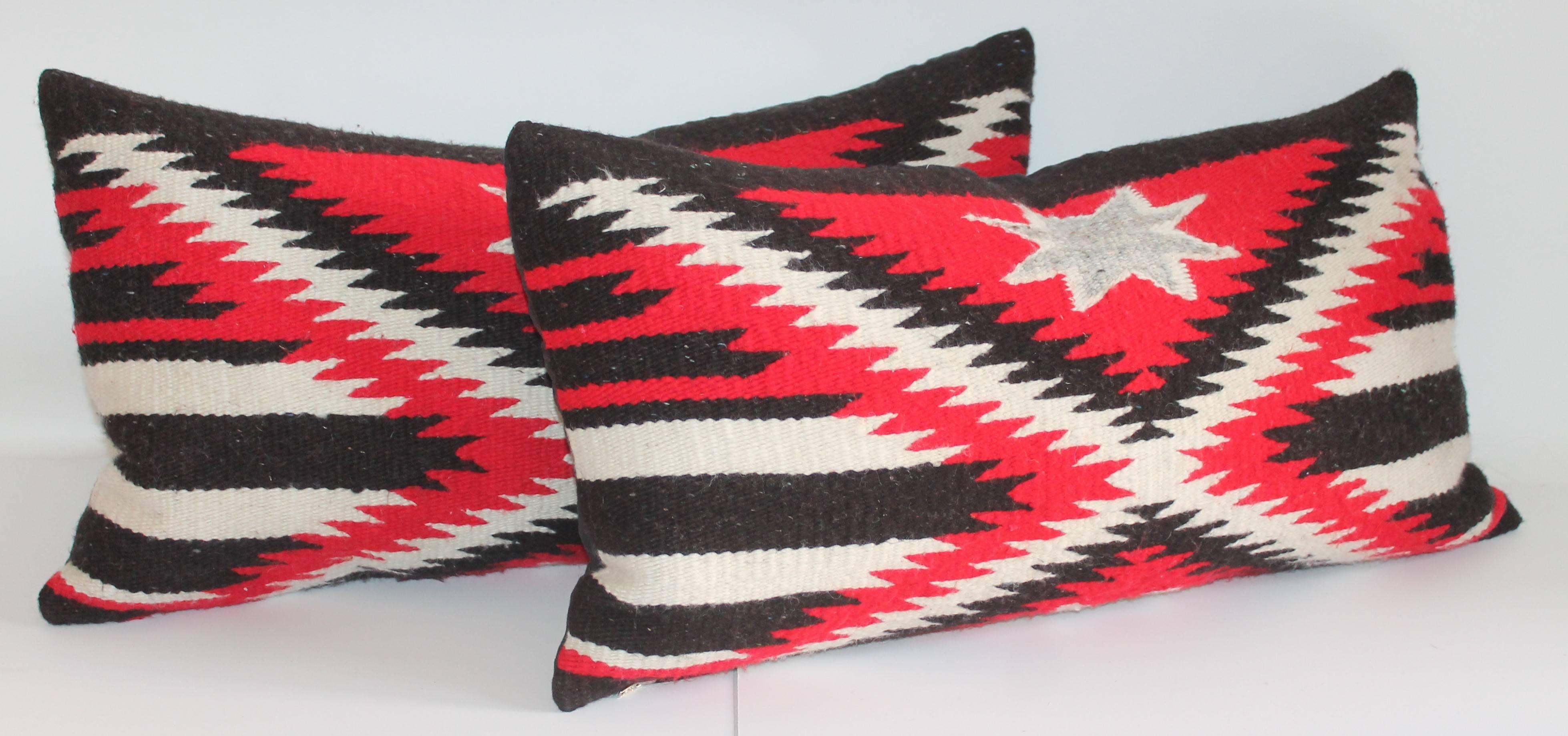 Really fantastic and geometric late but great star and stripes black, red and cream weaving bolster pillows. Sold as a pair.