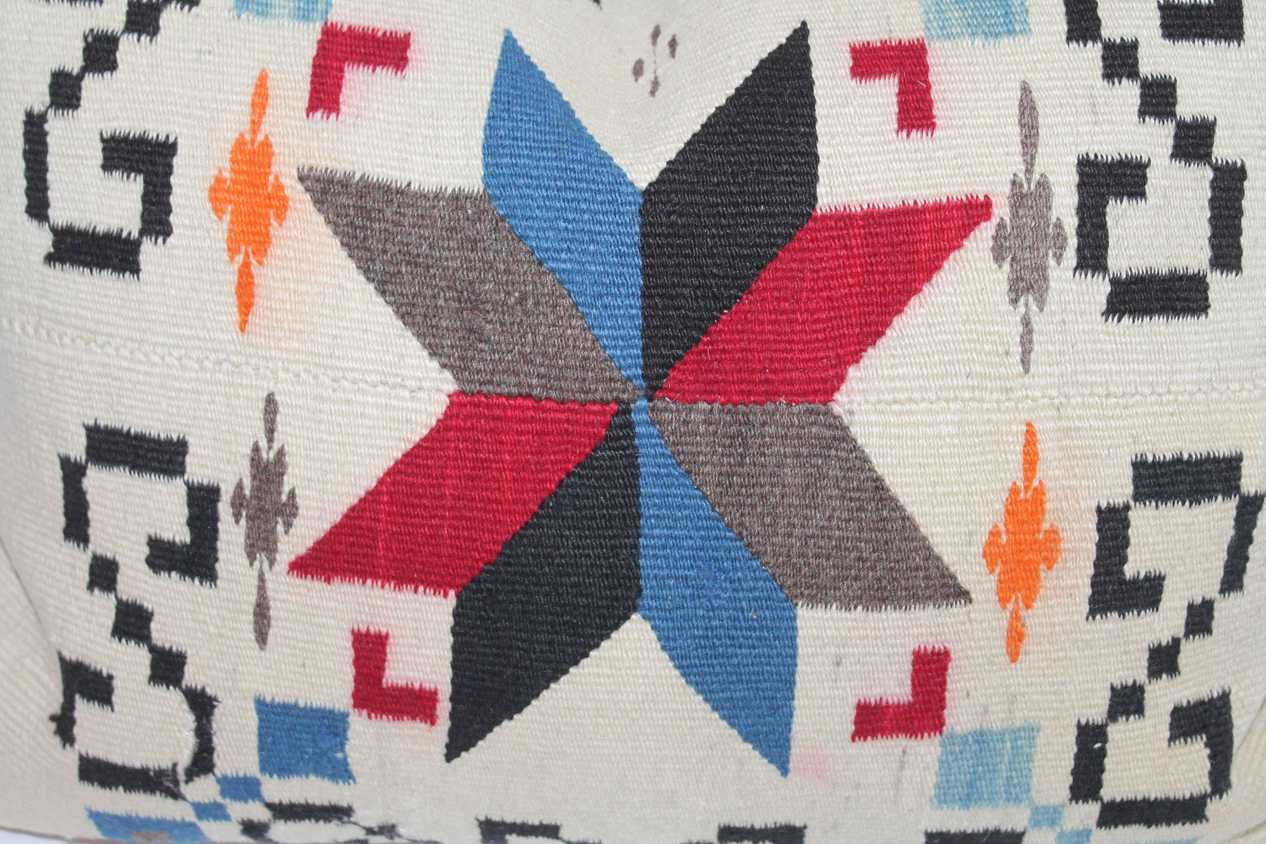 This early weaving star was cut from a very early saddle blanket and has a black cotton linen backing. The colorful and whimsical pattern make this pillow most unusual.