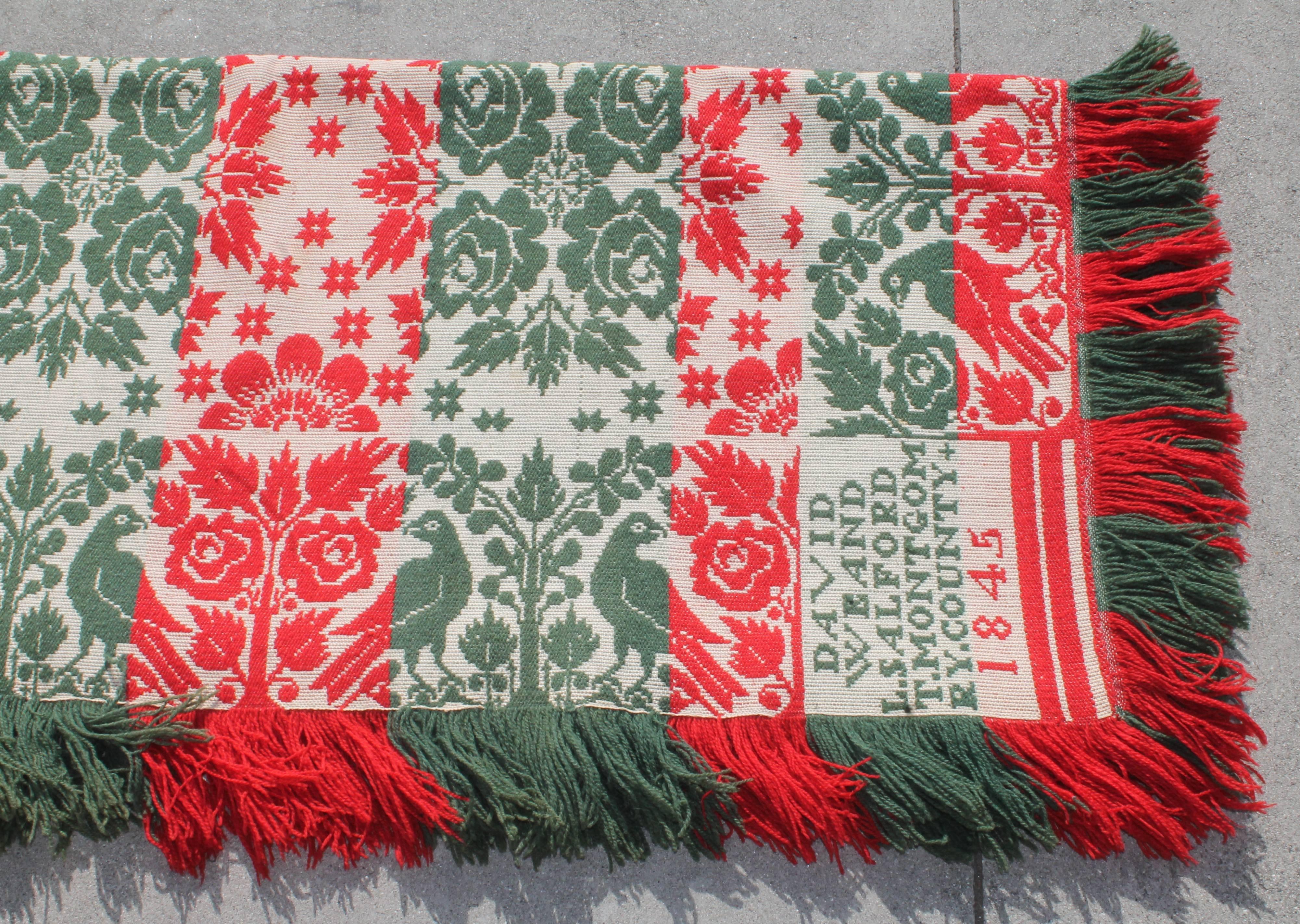 This fine Pennsylvania red and green handwoven coverlet with the original fringe is signed : 