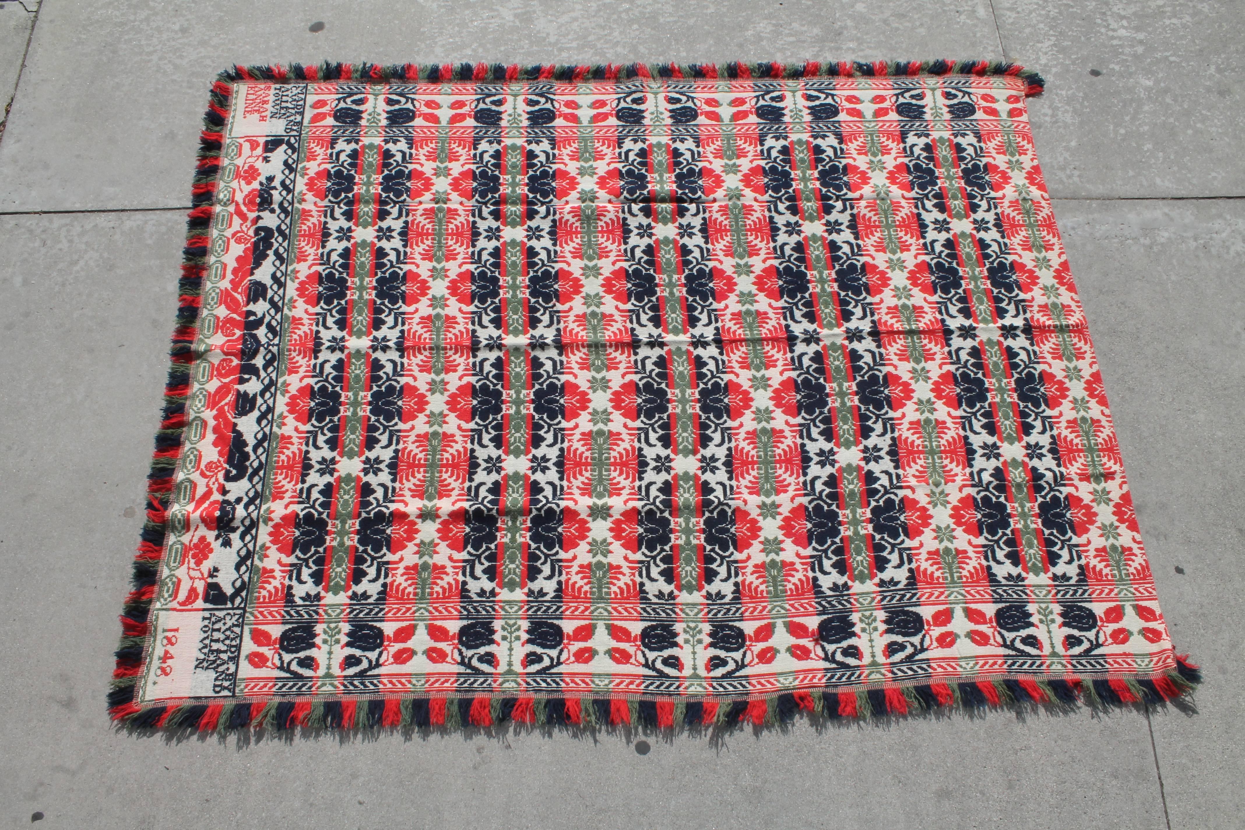 This handwoven rare Allentown, Pennsylvania coverlet is in fine condition with the original fringe. The coverlet is center seam and is in red, white and blue and green borders colors.