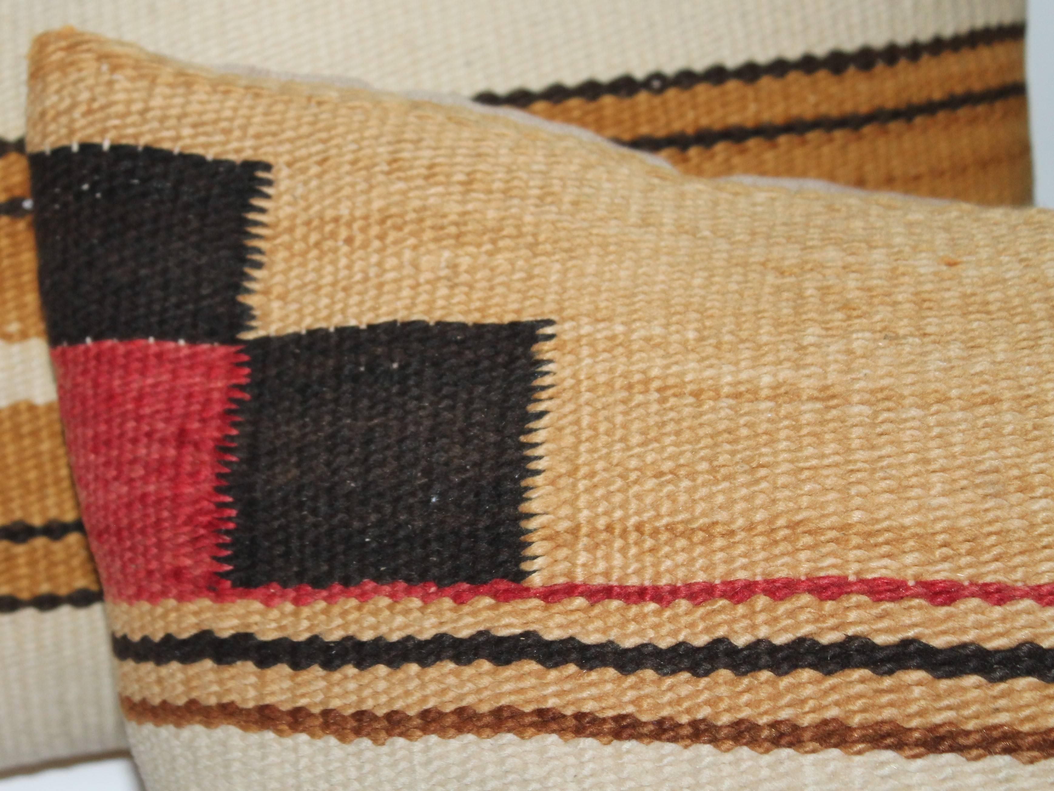 These amazing mustard and cream striped colored Indian weaving pillows have tan cotton linen backings. The condition are very good. All three are slightly different from one another. Sold as a group of three.