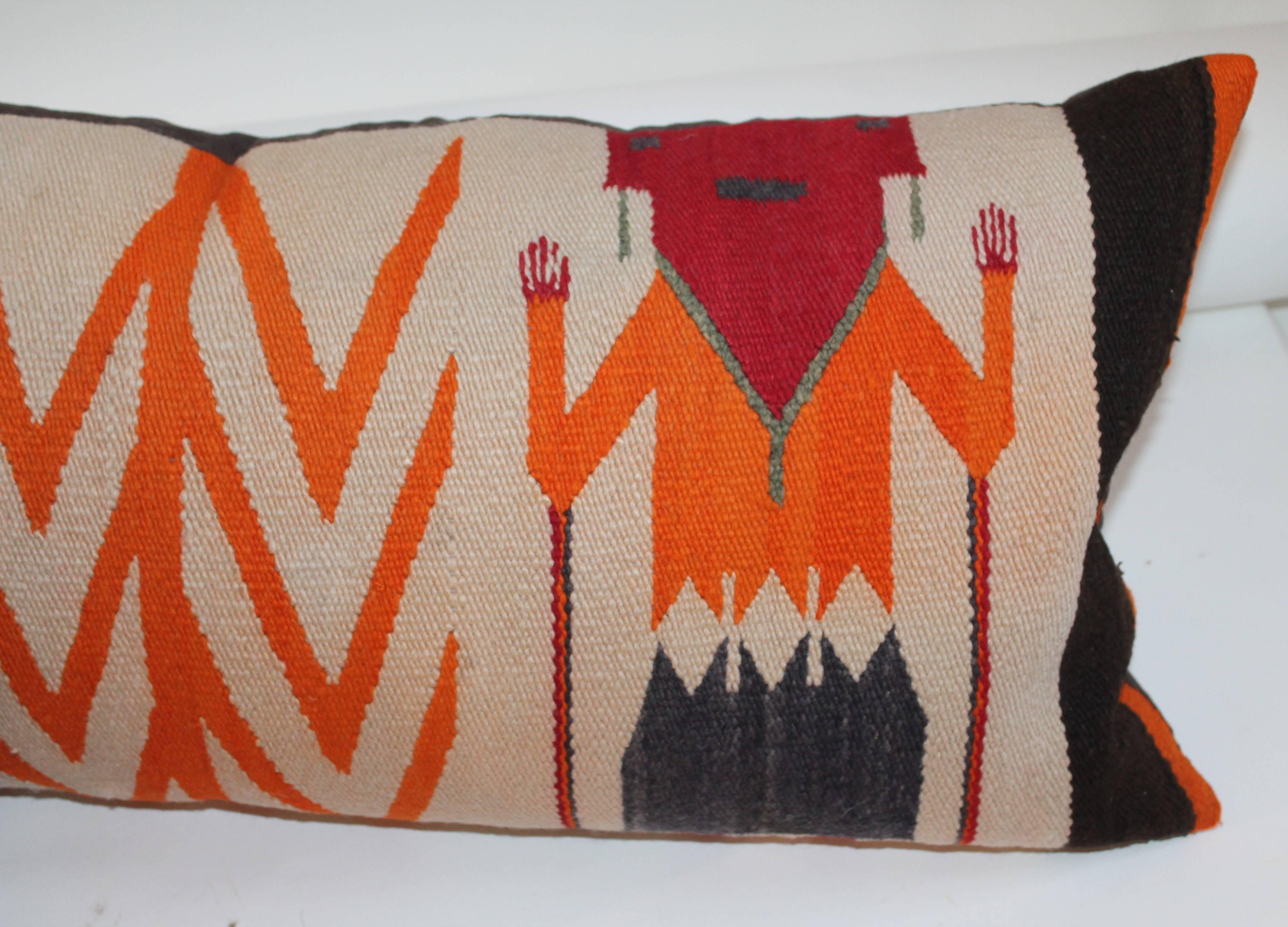 Two most unusual Yea Indian weaving bolster pillows. Fantastic colors and condition. The brown, red and cream bolster is 35