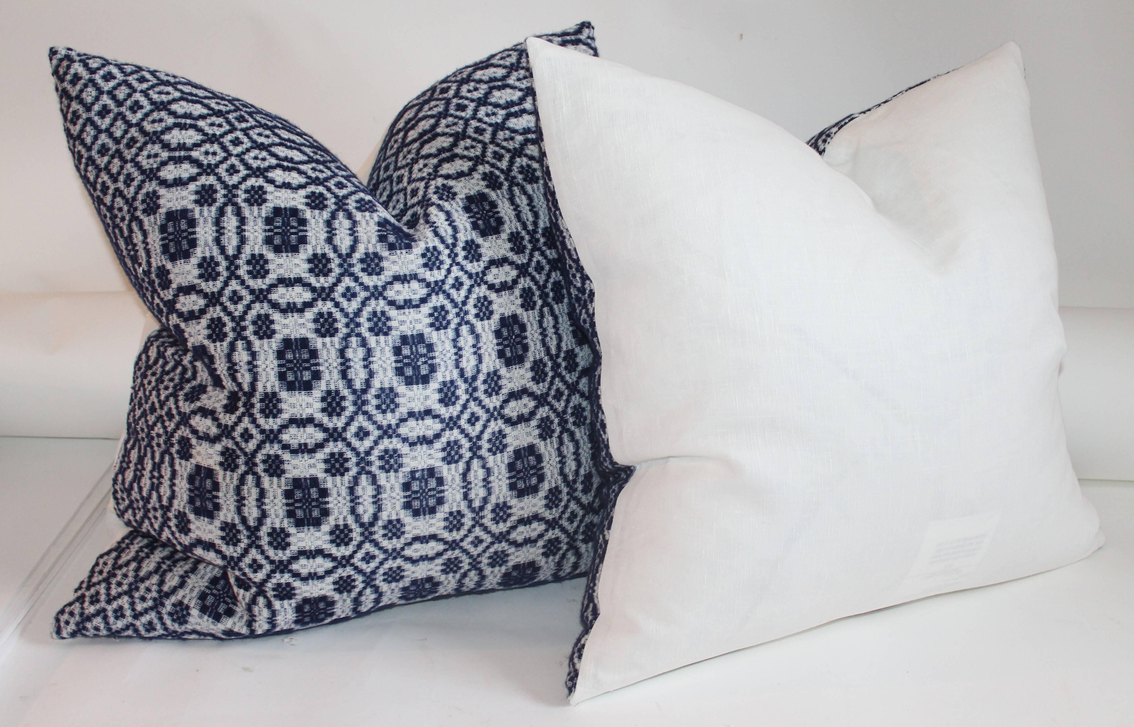 These handwoven coverlet pillows are in deep blue and white and have white linen backings. The condition are pristine. Three pairs in stock.
