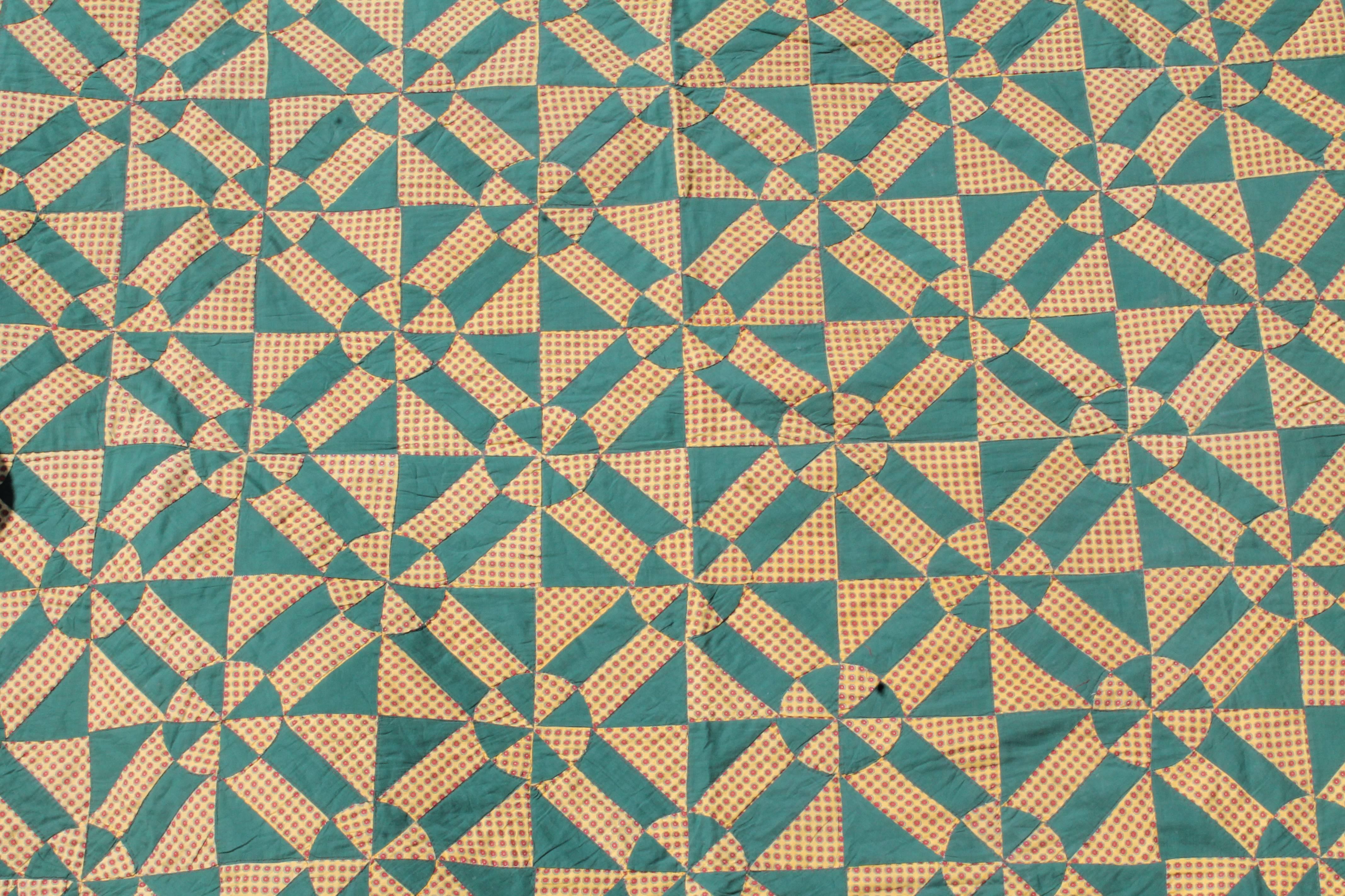 American 19th Century, Geometric Pinwheels Green and Tan Quilt
