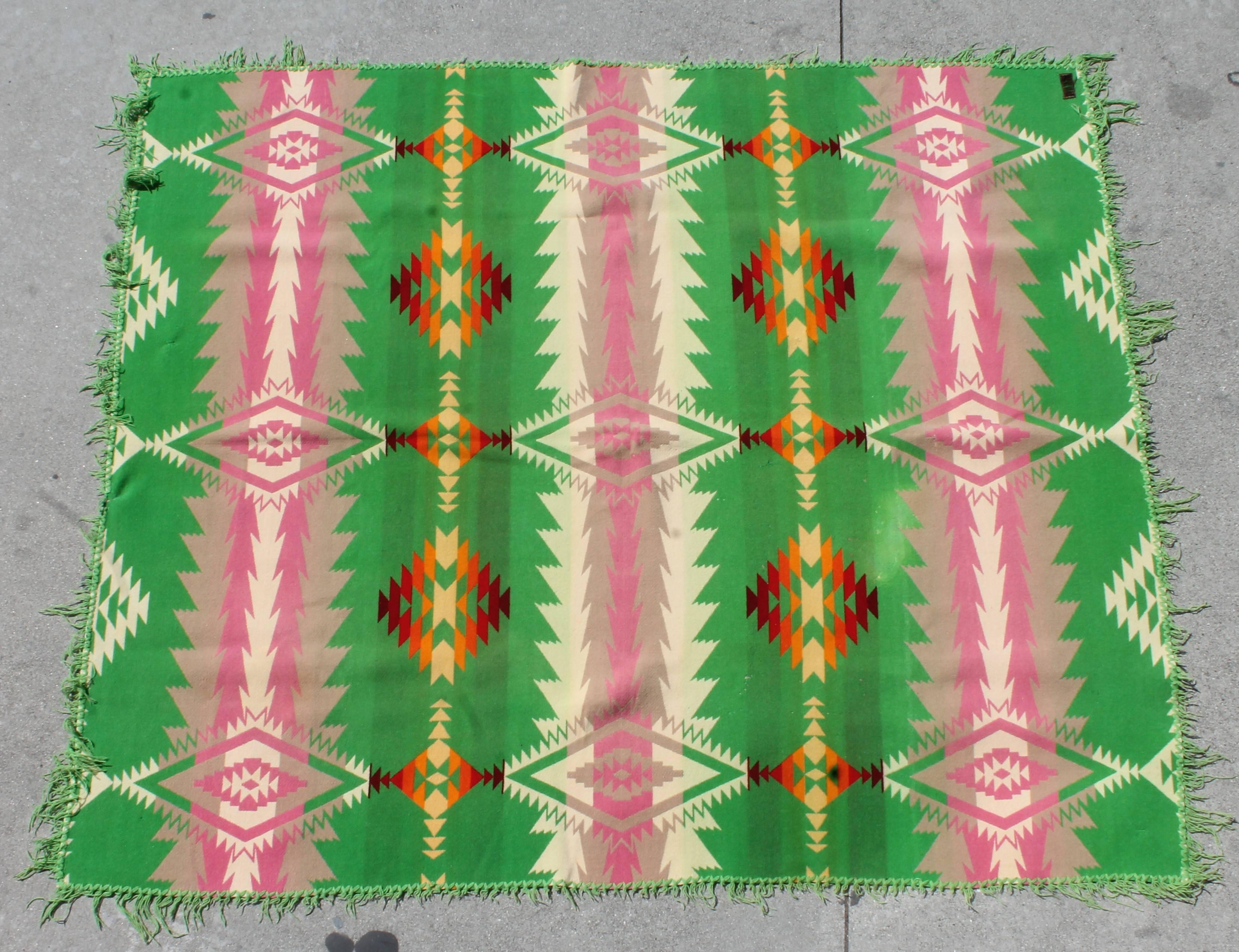 This Cayuse Indian camp blanket is dated 1909 and is in good condition with exception to the loss of fringe. The fringe could be removed easily. The colors are most unusual and vivid. This blanket retains the original worn label.