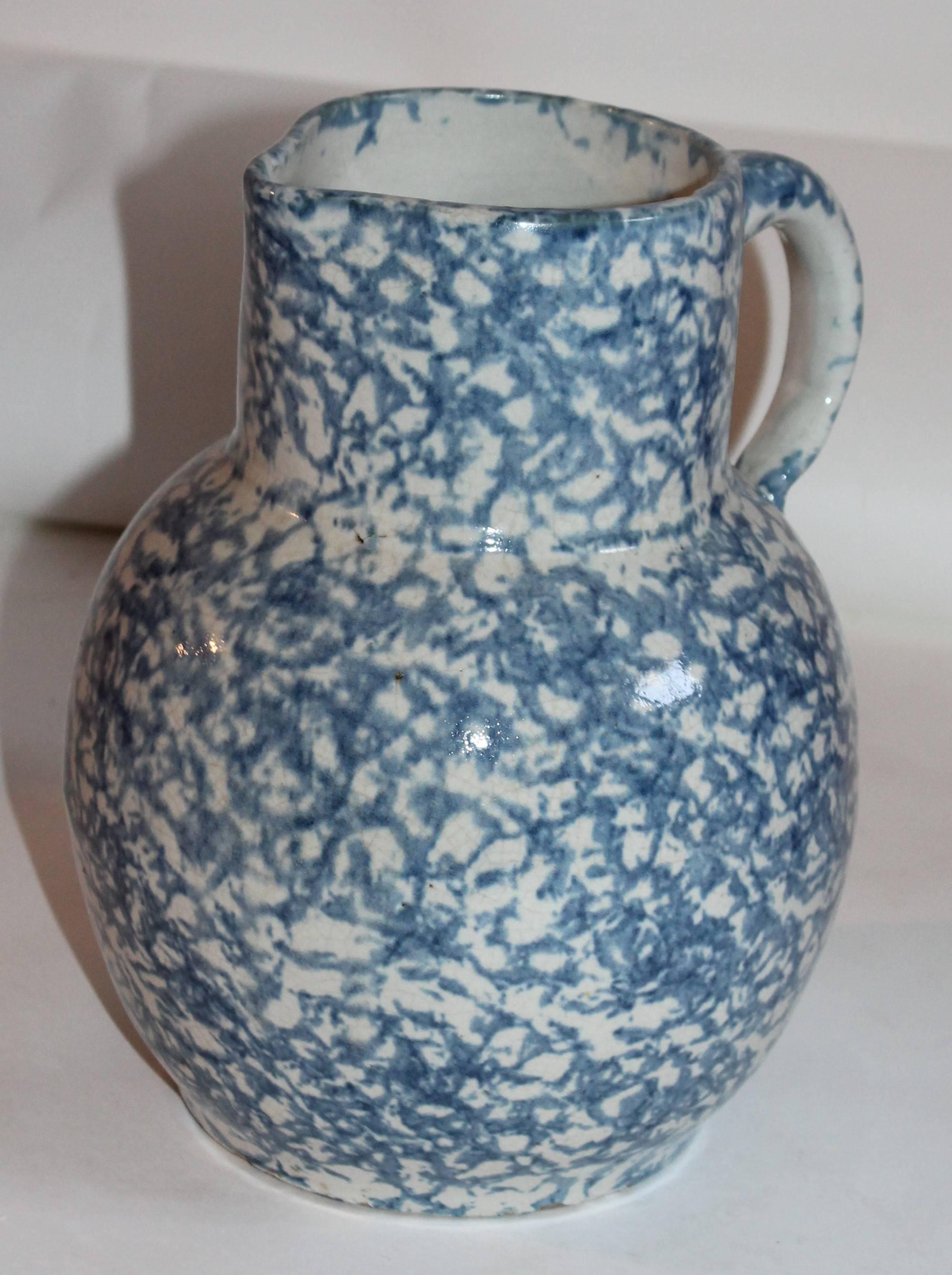 This most unusual form 19th century spongeware pottery pitcher in a soft sky blue. It reminds you of the ocean or clear ski blue. The condition is very good.