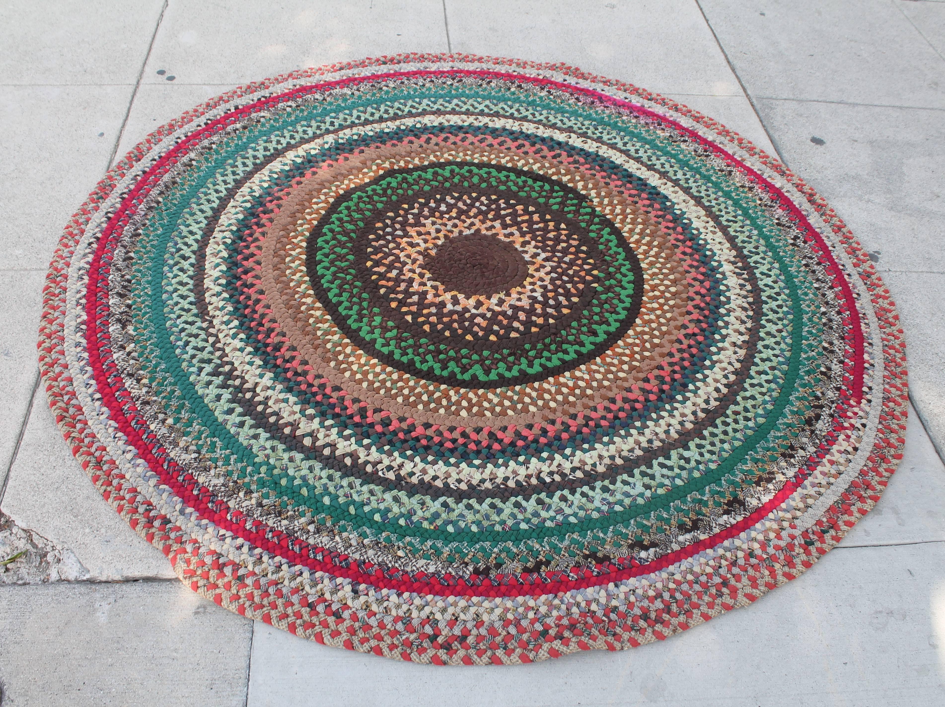 This round area rug is in good condition and measure seven foot round. The colors are really wonderful. The rug is all wool. Minor wear on edge of the rug.