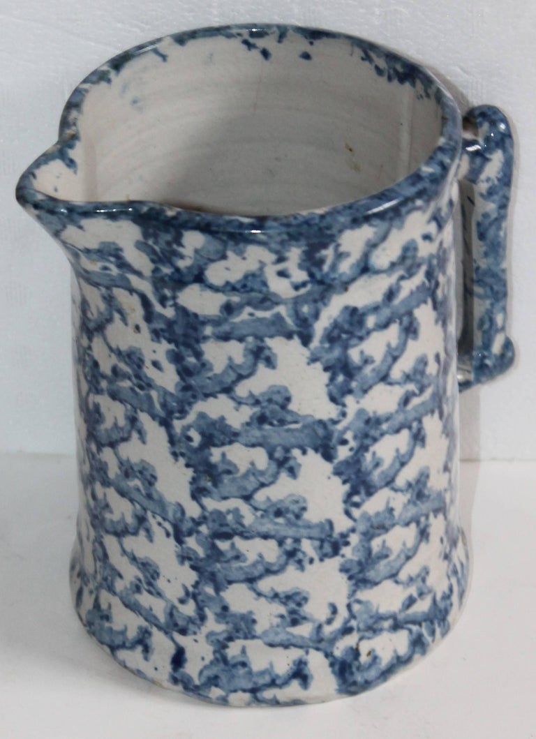 19th century sponge ware milk or water pitcher is in great condition. The color is a deep blue and white.