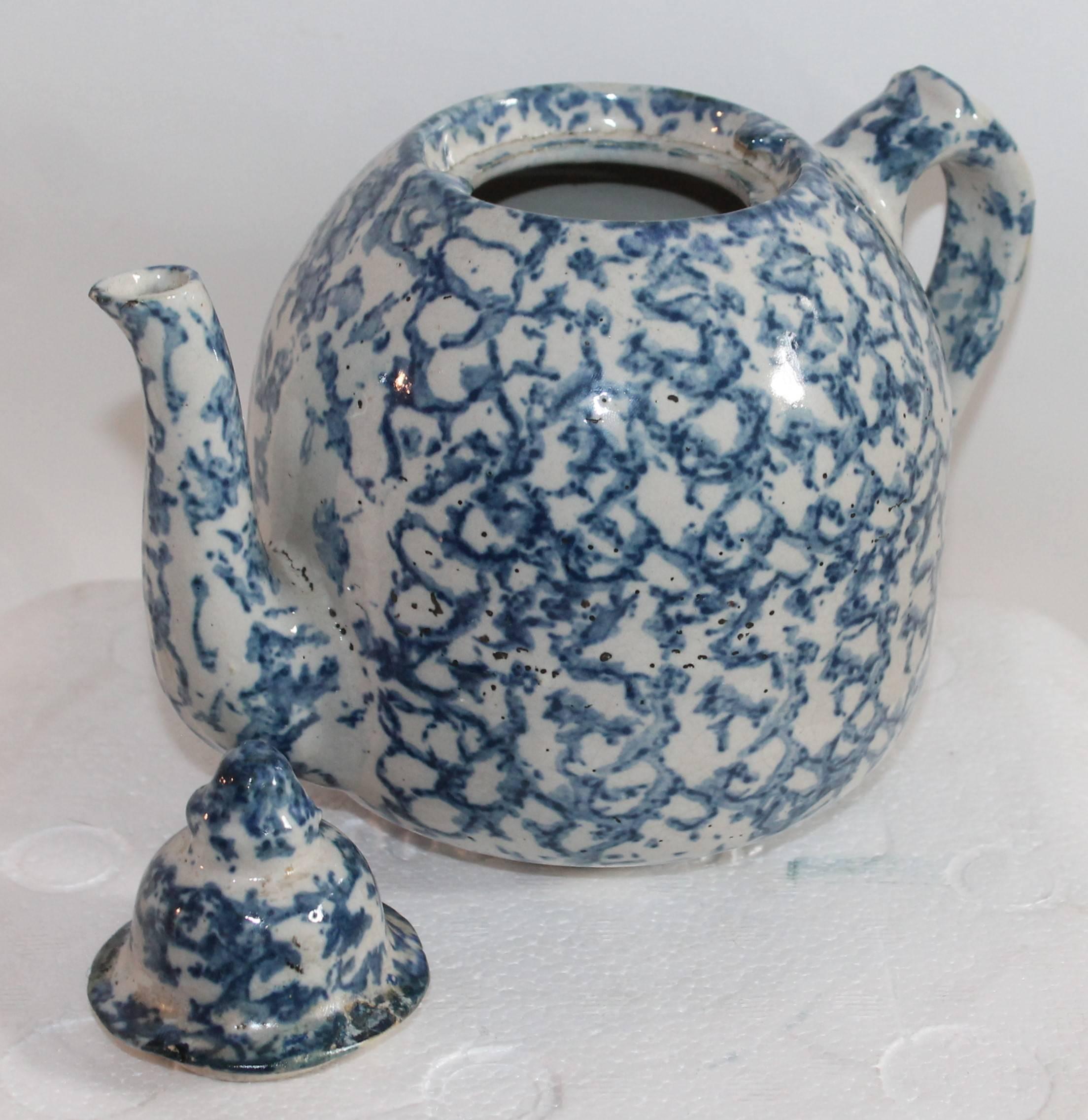 This most unusual sponge ware teapot has the original lid and is in fine condition with the exception of minor small old repairs. There are no cracks or chips. Great colors and form.