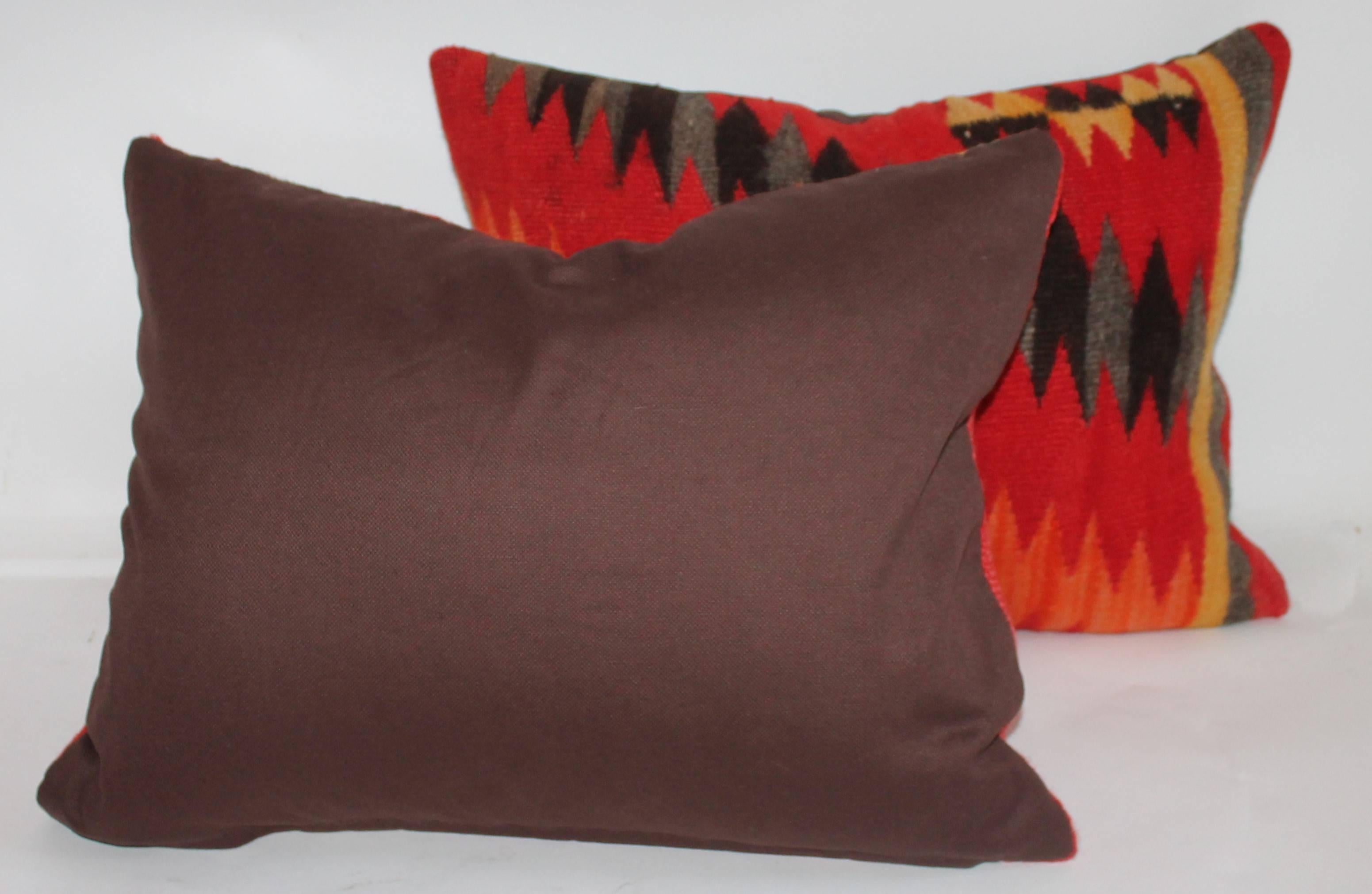 These streak of lighting pillows are in fine condition and have brown cotton linen backings. Sold as a pair.