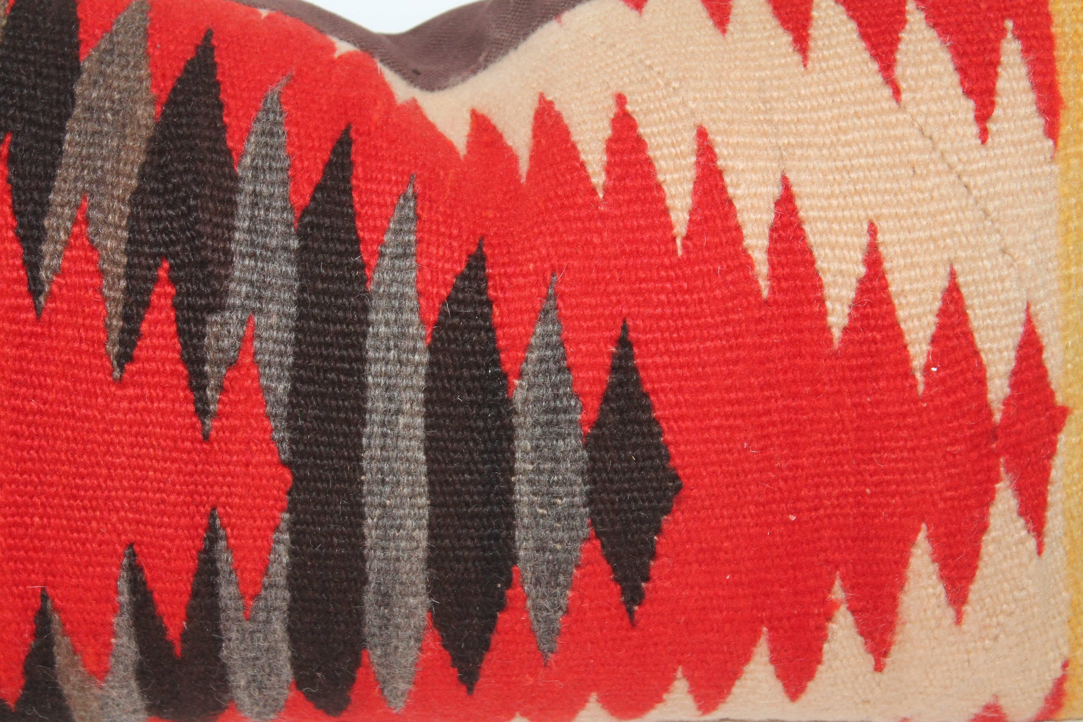 This early 1900 Navajo weaving pillow is in fine condition with a brown cotton linen backing.