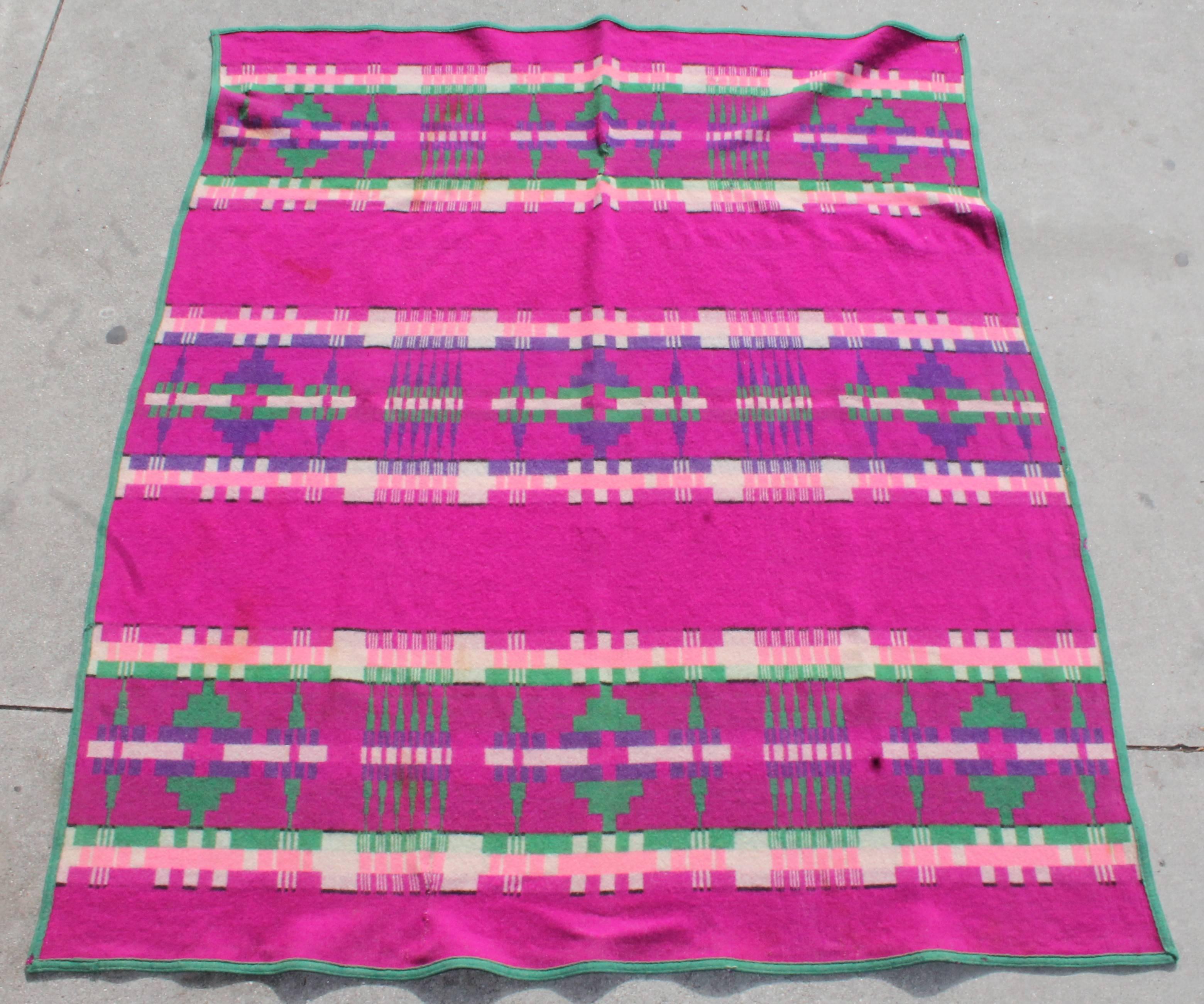 1909 Cayuse Pendleton blanket with vibrant rare colors. This blanket has wear consistent with age and use. There are two minor old repairs to the blanket. The label on this Pendleton is in amazing condition and is the original label.