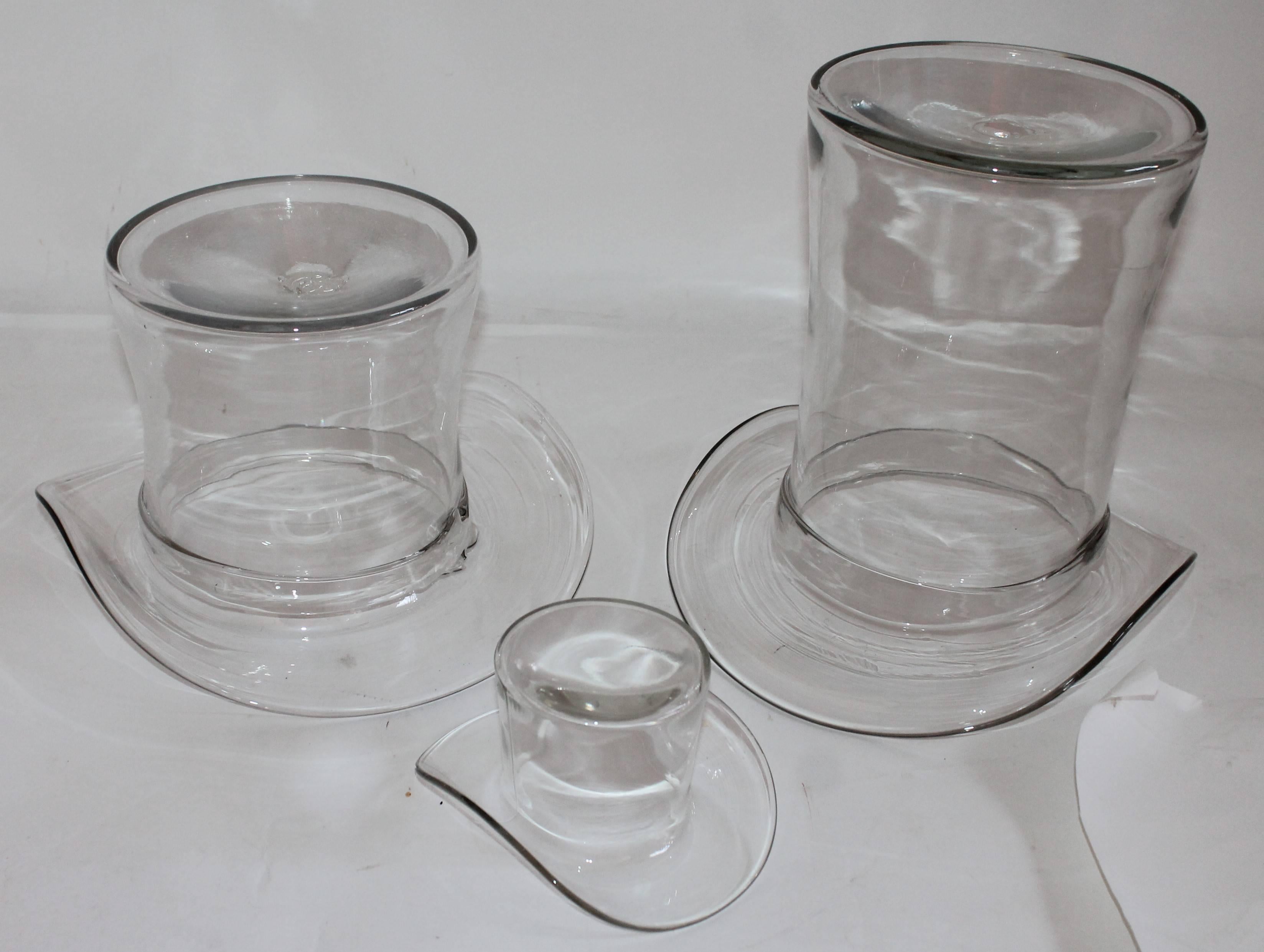 These fine handblown glass top hats are in great condition. Sold as a group of three.