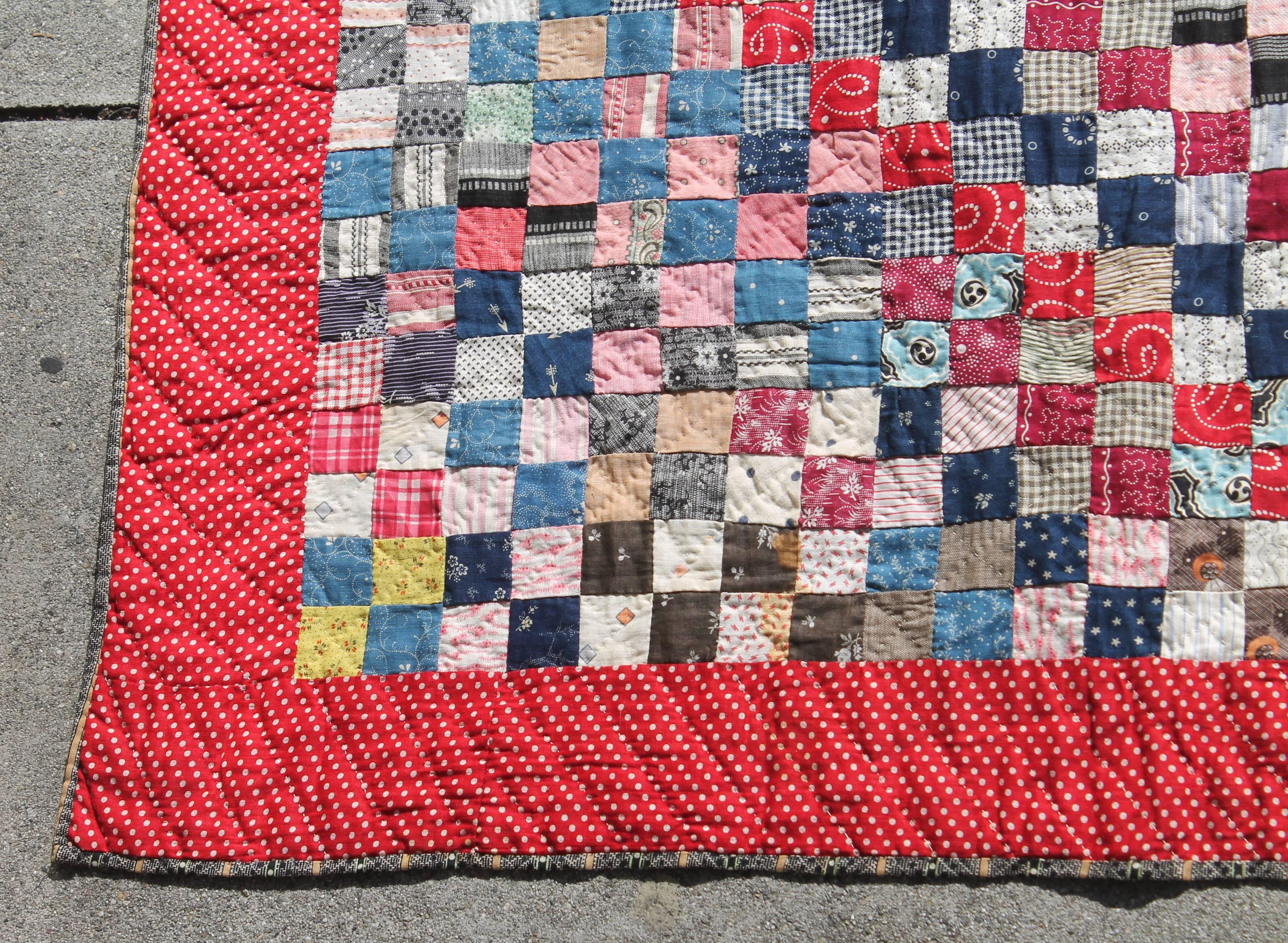 This fine 19th century tiny pieced postage stamp quilt is in pristine condition. There are thousands of pieces and multi colors. This fine museum quality quilt was found in a estate in Pennsylvania.