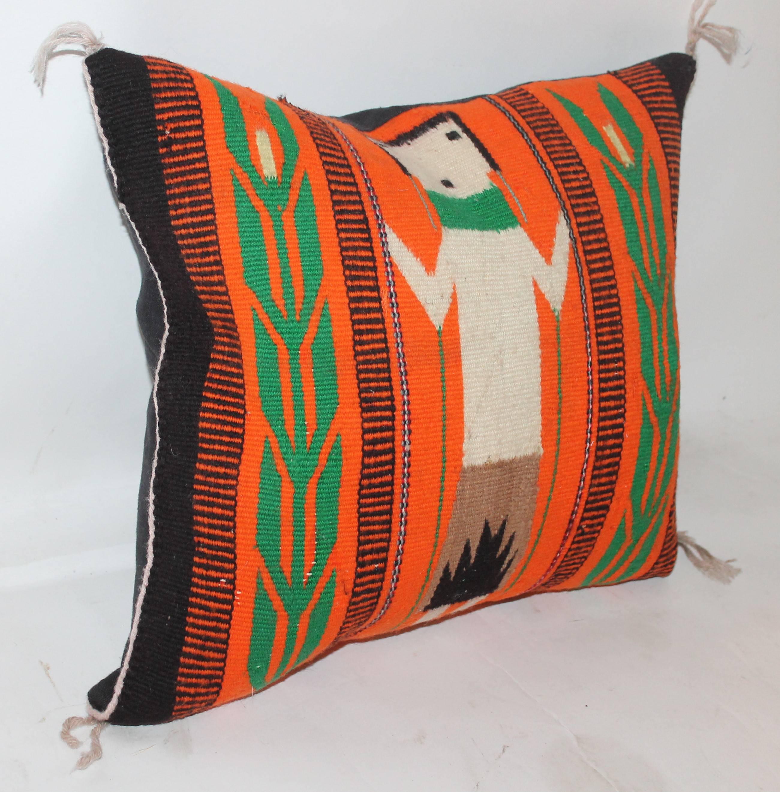 Navajo Indian weaving with a vivid orange back round color. This small gem is in Fine condition and is quite rare or unusual to see. The backing is in black cotton linen.