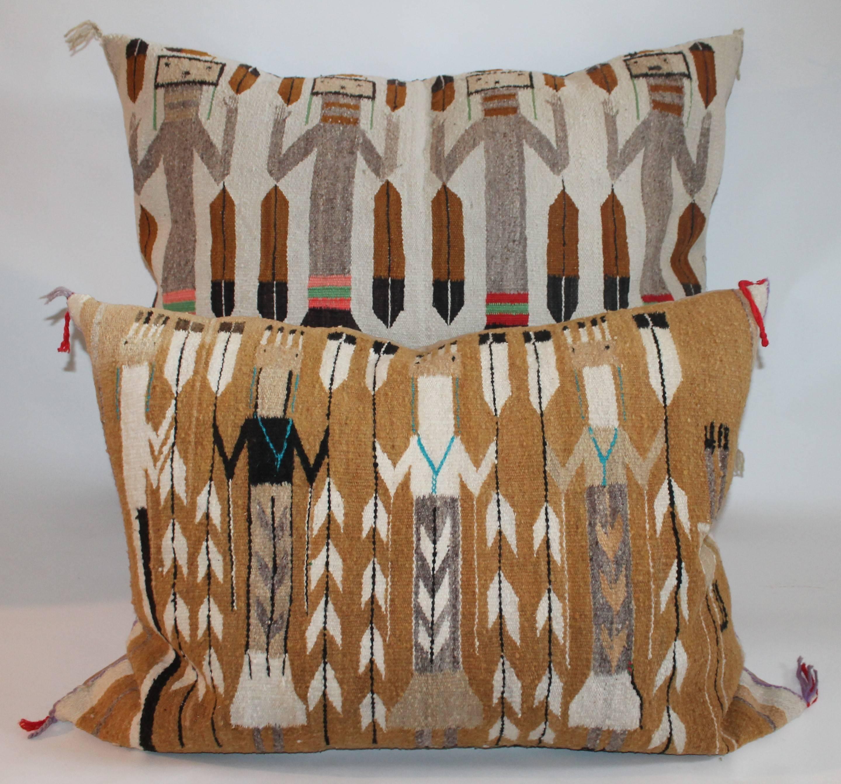 The condition is very good and sharp. The backing is in tan cotton linen.
The smaller of the two which is the Yea Pillow with the white feather pattern in between the Yea tribe members measures 26 inches high x 34.5 inches wide. Depth of the pillow