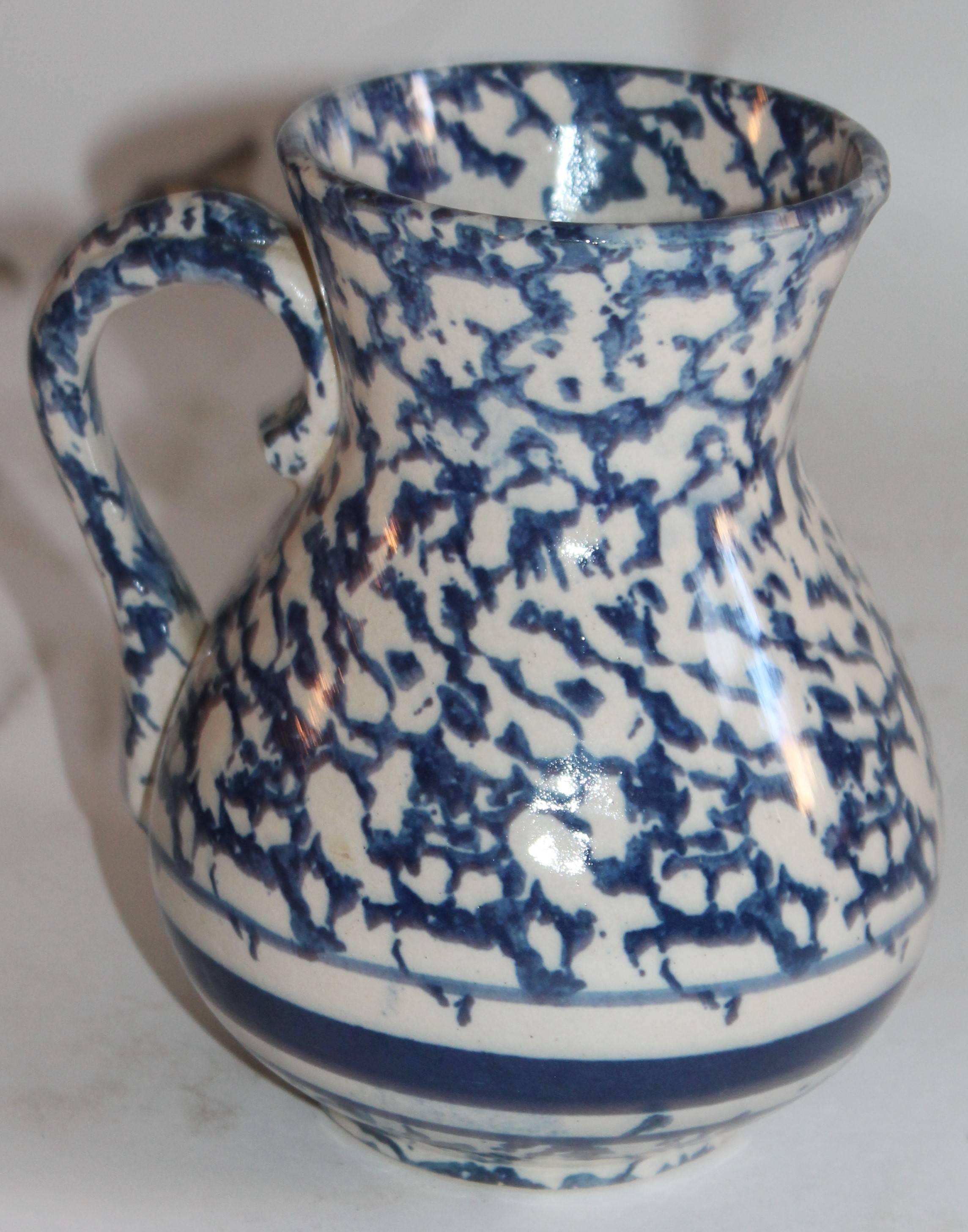 This medium size 19th century sponge ware pottery pitcher is in very good condition. This is the middle size pitcher good for flowers or a wall cabinet. Great addition to any collection.